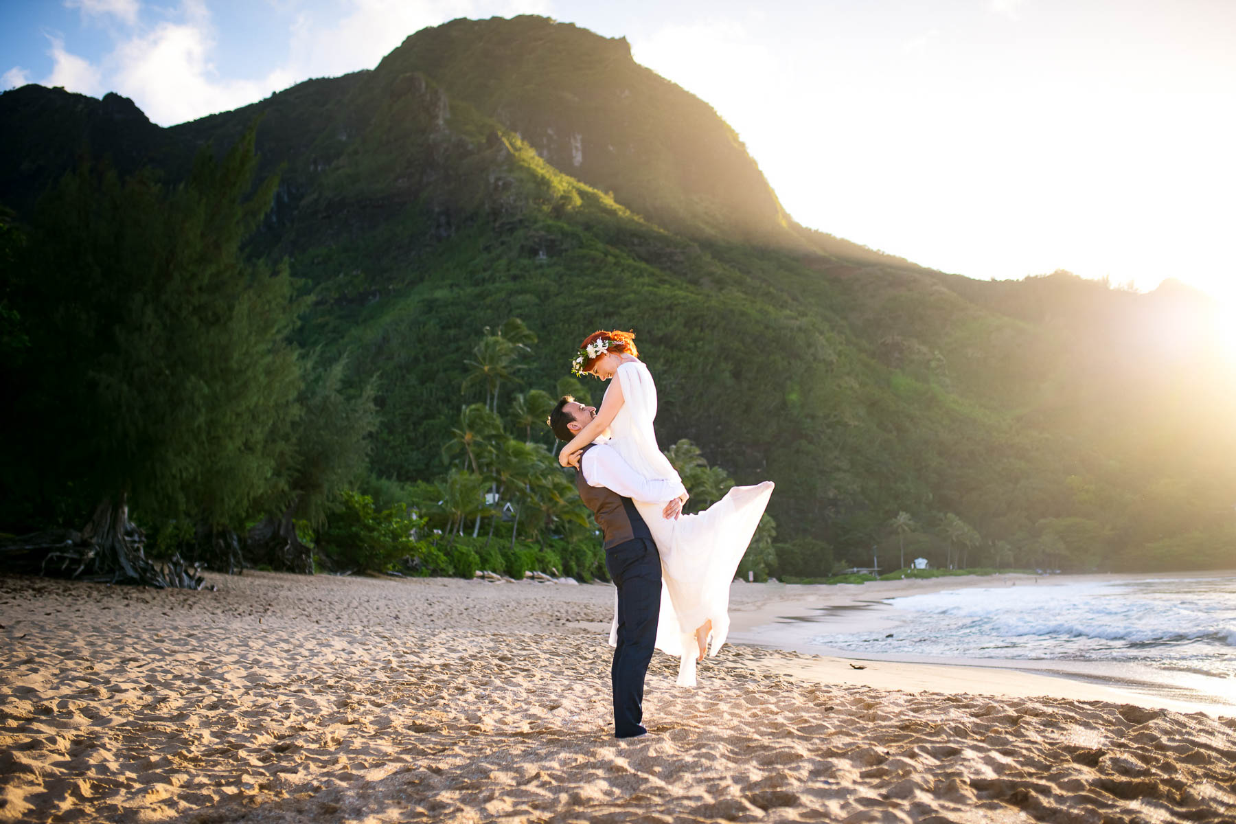 couple eloping on the beach in kauai wedding photos at sunset