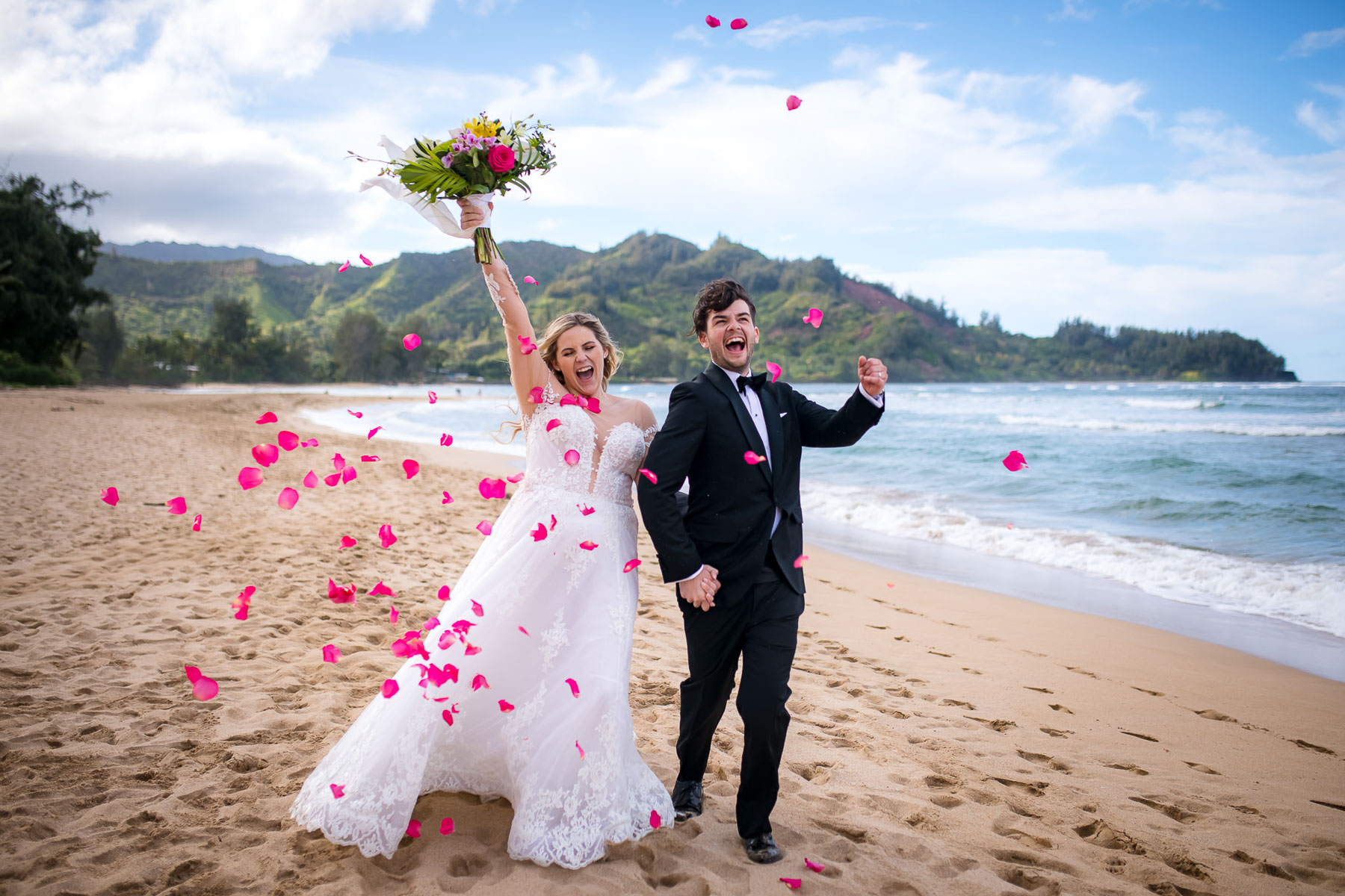 Couple celebrating after getting married on Kauai