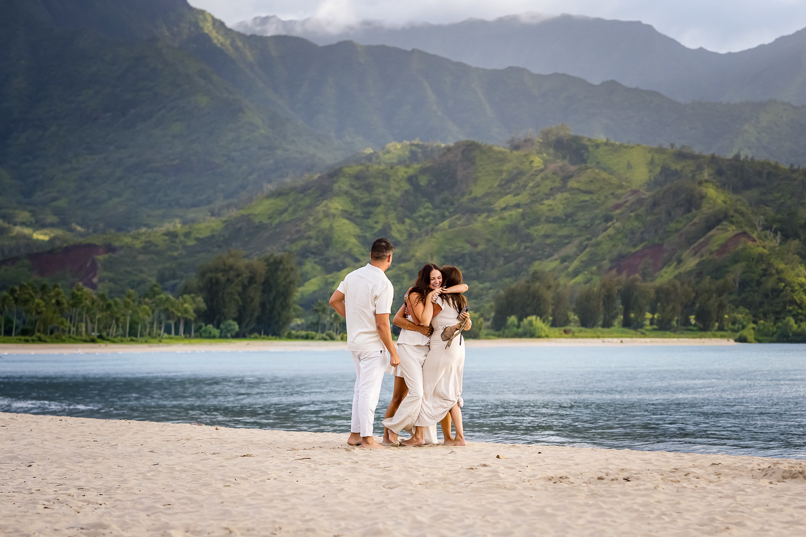 family embraces after surprise proposal on kauai