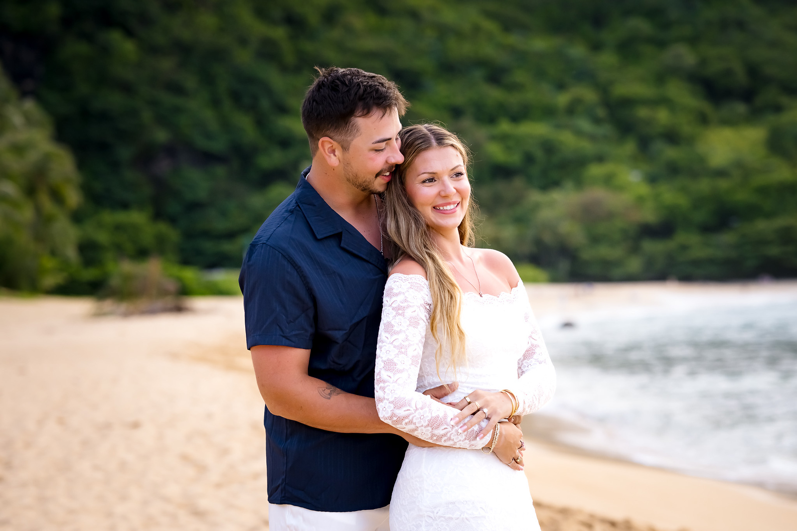 couple posing on tunnels beach kauai