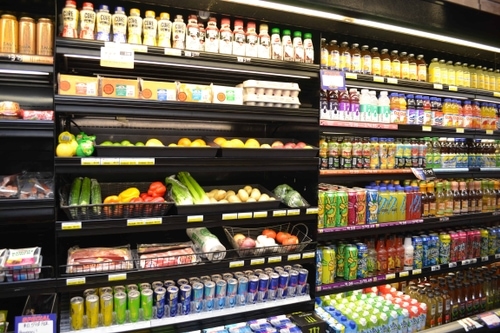 Grocery section displaying produce and beverages.