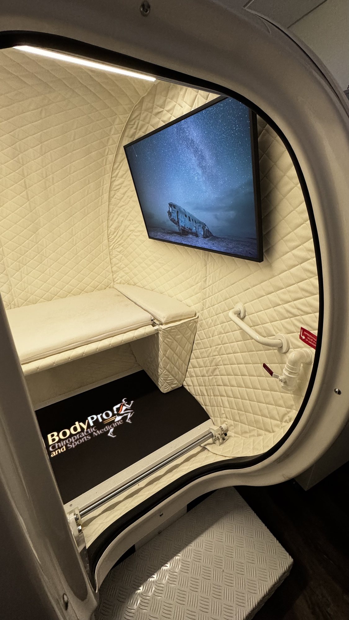 Hyperbaric oxygen therapy session interior with TV at BodyPro Santa Monica