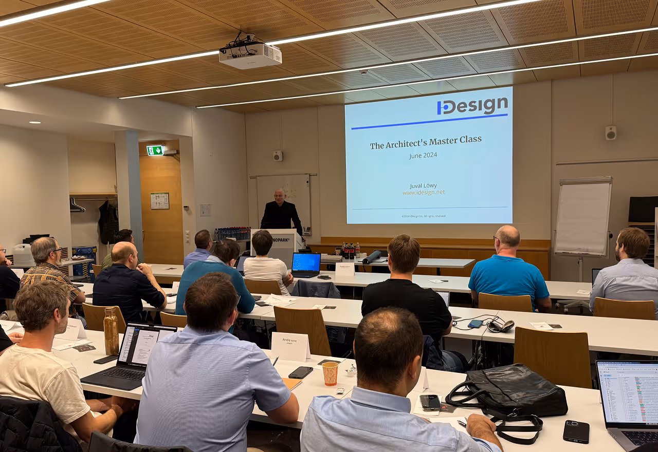 Classroom setting with an instructor presenting 'The Architect's Master Class June 2024' to attendees.