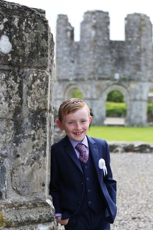 Communion boy at Melifont Abbey by Jenny Callanan Photography