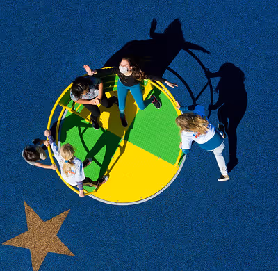 kids playing in the circle swing