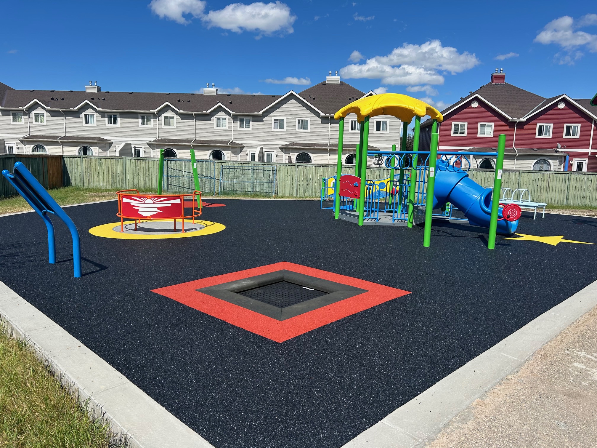 Bayside Rise inclusive playground equipment in Airdrie with climbing structures and accessible play features