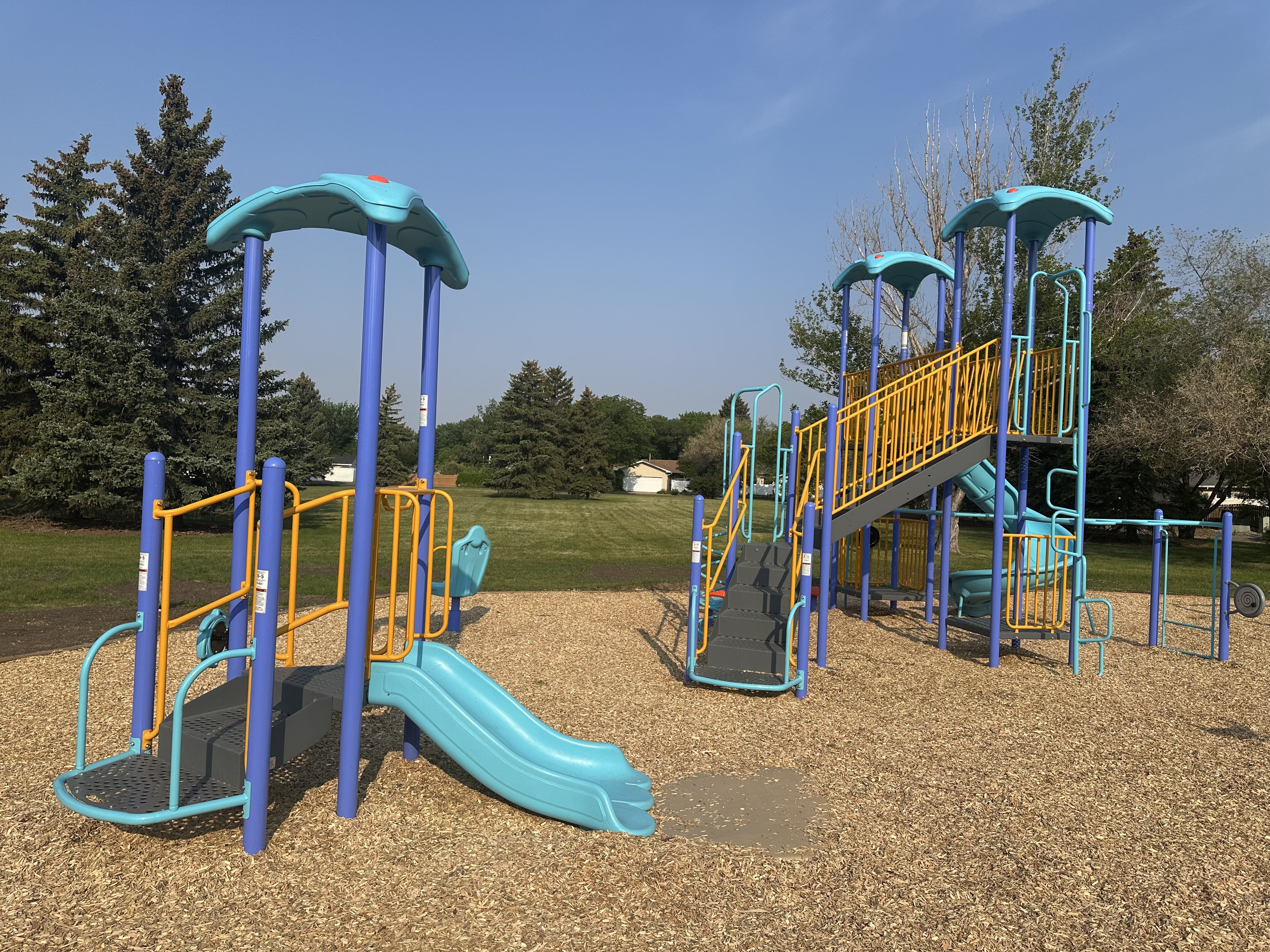 Dalgliesh Park inclusive playground in Regina with accessible play equipment and safety surfacing