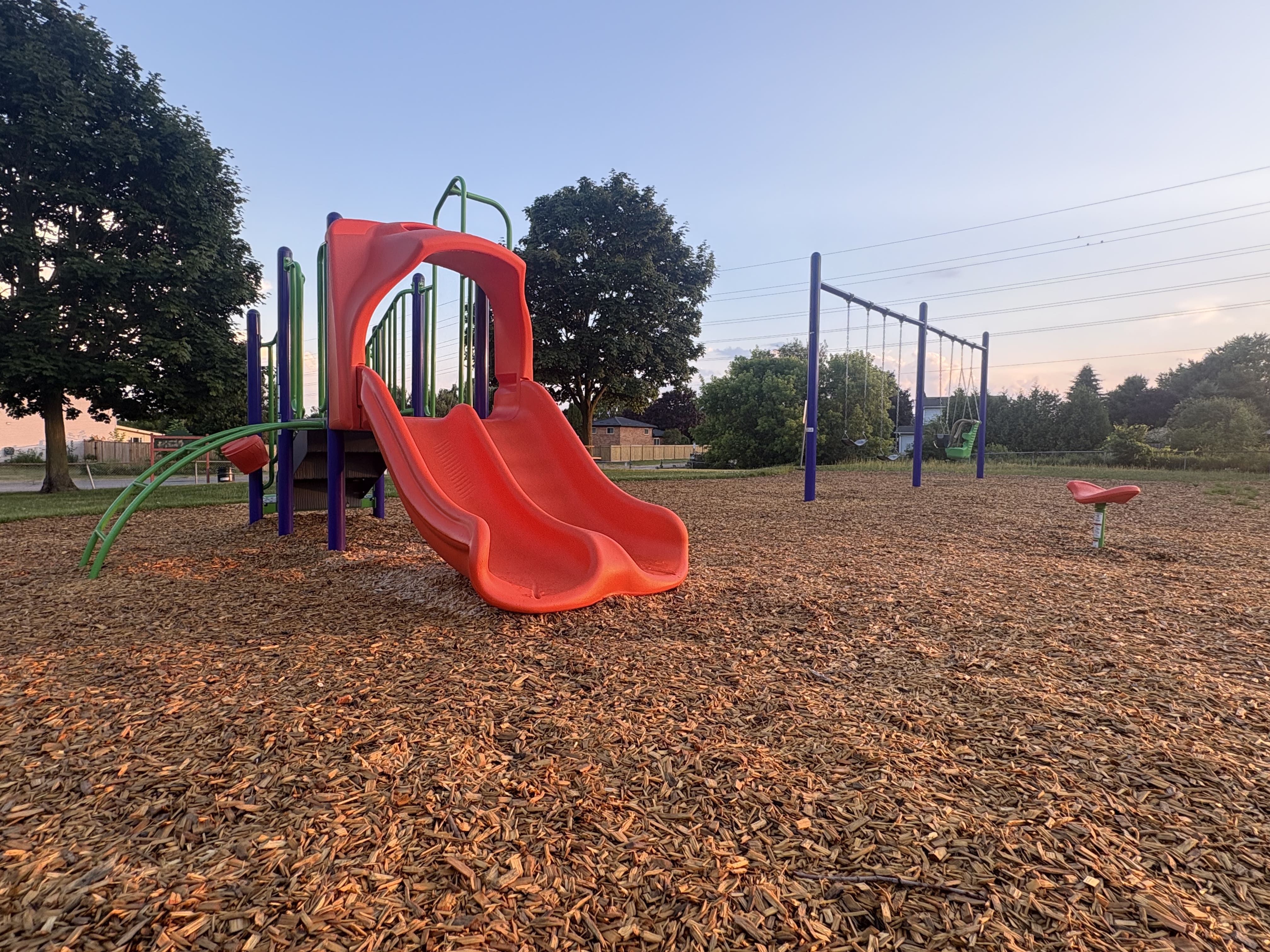 Hewson Park playground equipment in Port Hope, ON with natural and built play elements
