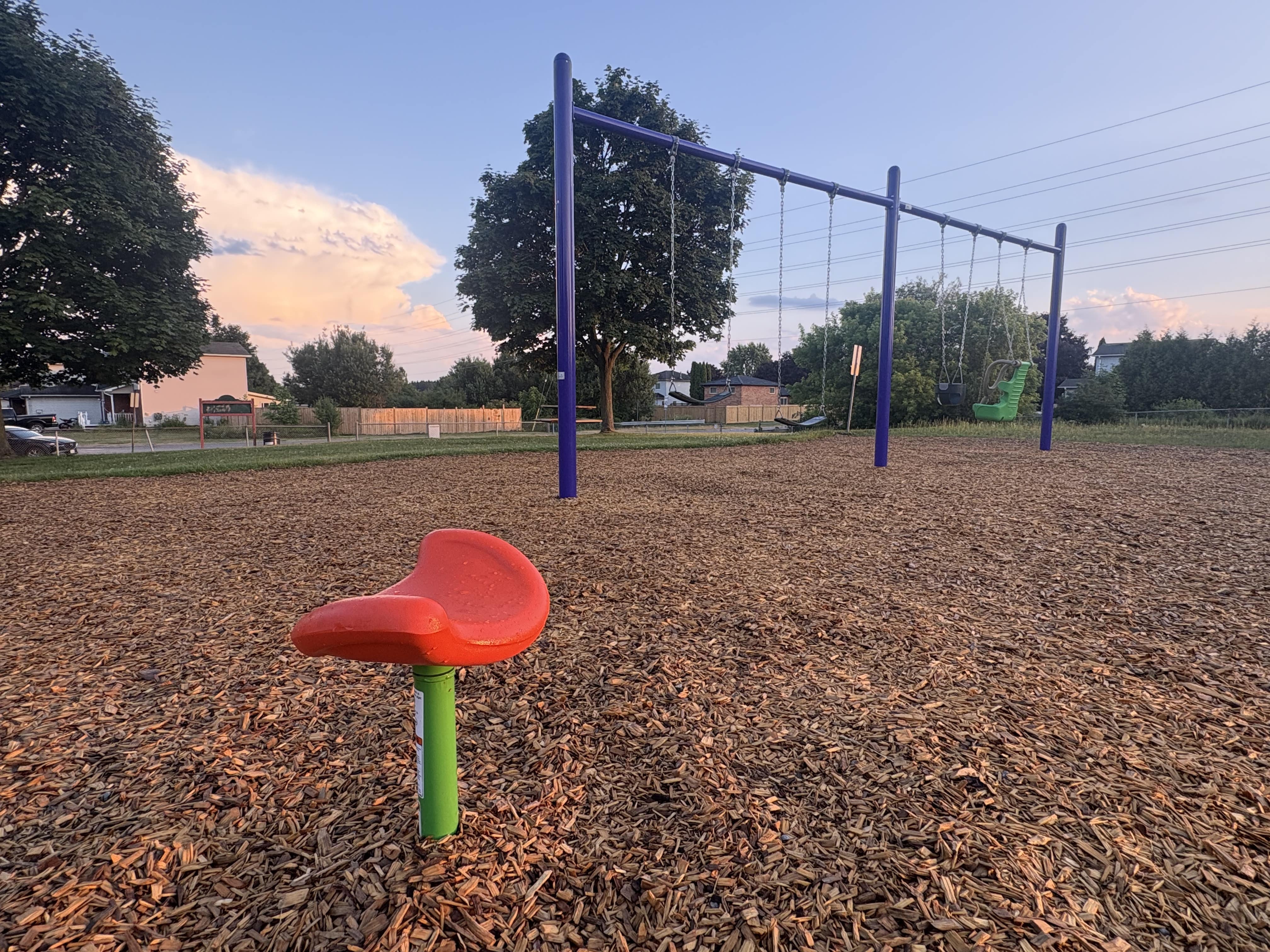Hewson Park playground equipment in Port Hope, ON featuring slides and activity panels