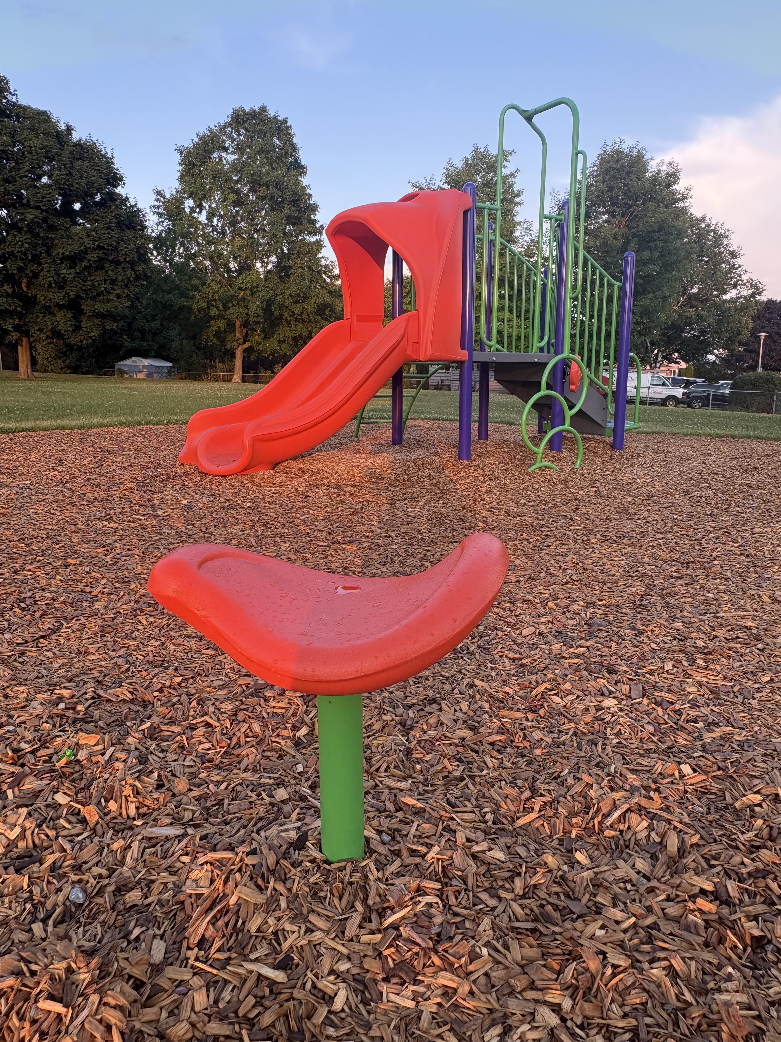 Hewson Park playground equipment in Port Hope, ON showing swing sets and climbing areas