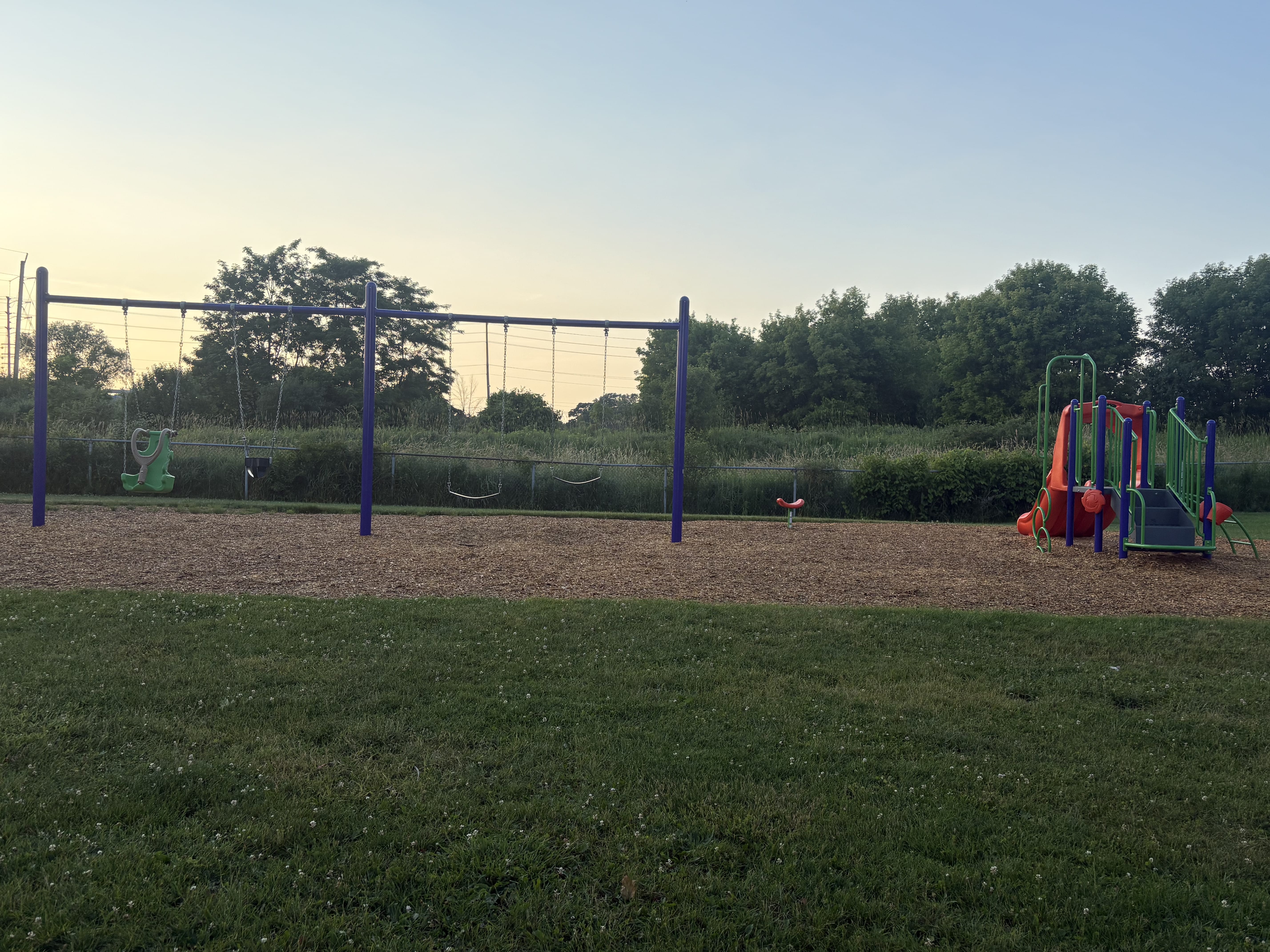 Hewson Park playground equipment in Port Hope, ON with climbing and sliding features