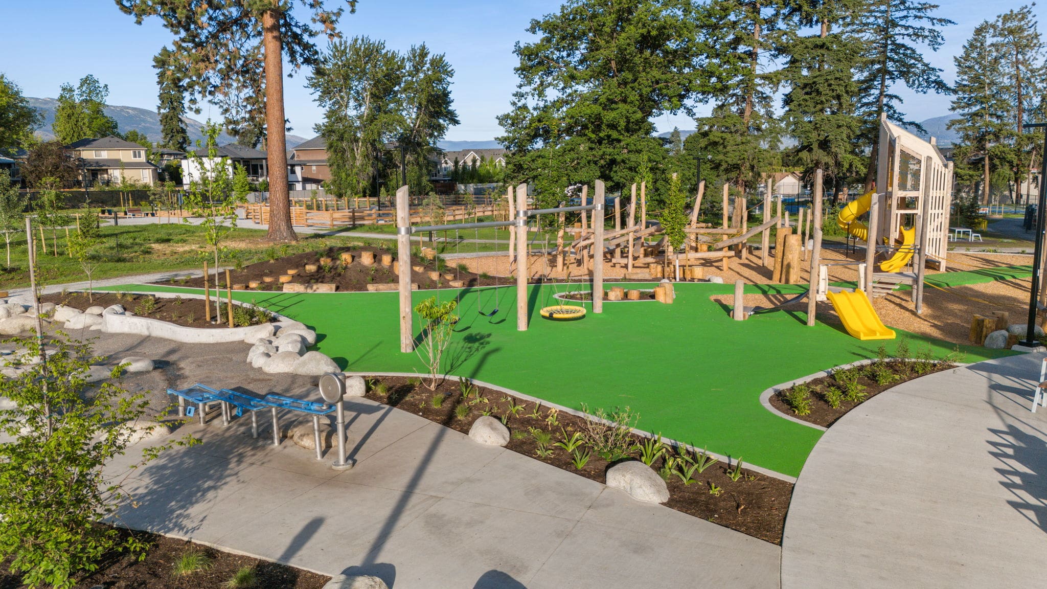 DeHart Community Park playground equipment in Kelowna, BC with inclusive play features