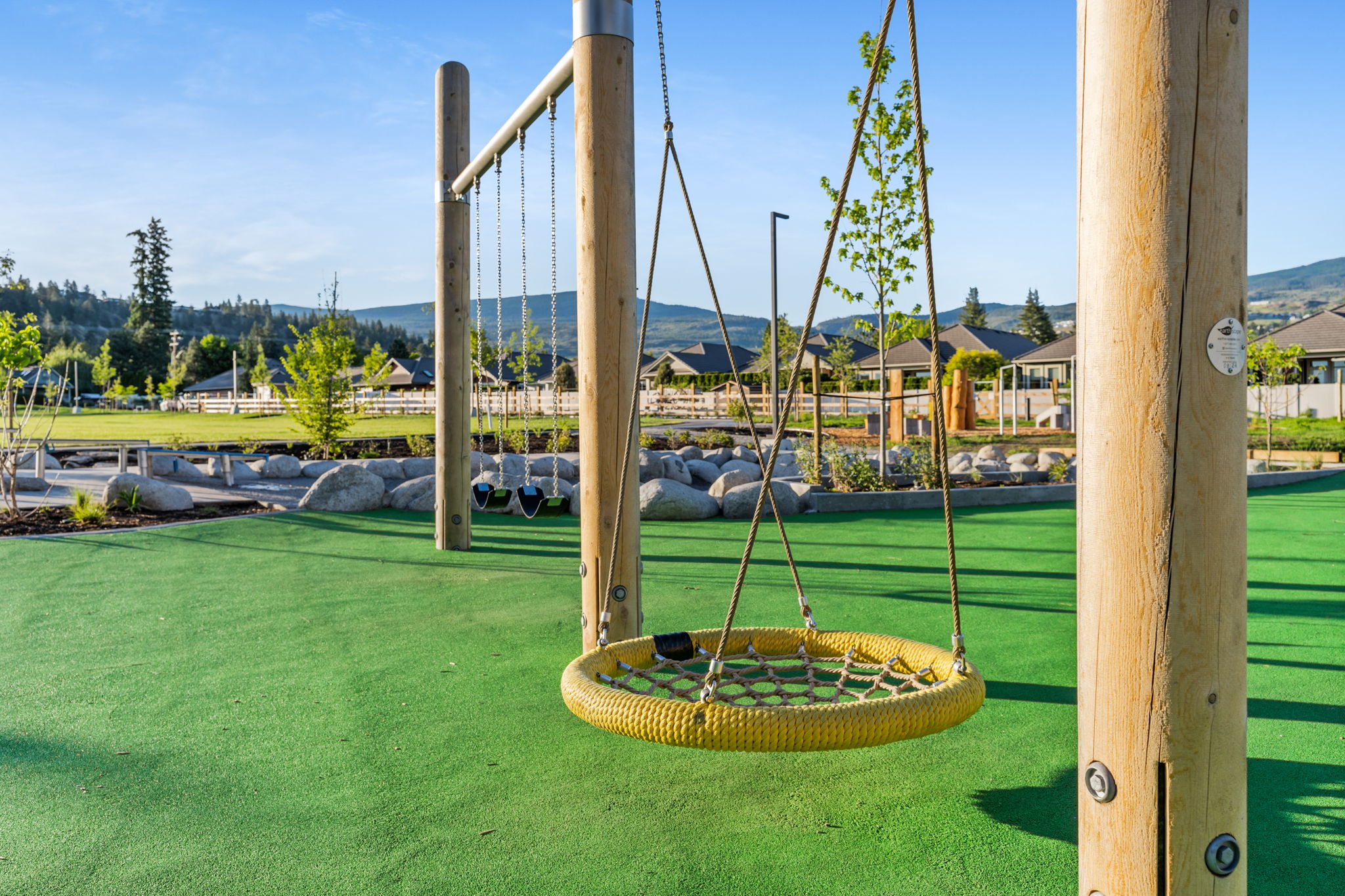 DeHart Community Park playground equipment in Kelowna, BC featuring community playground