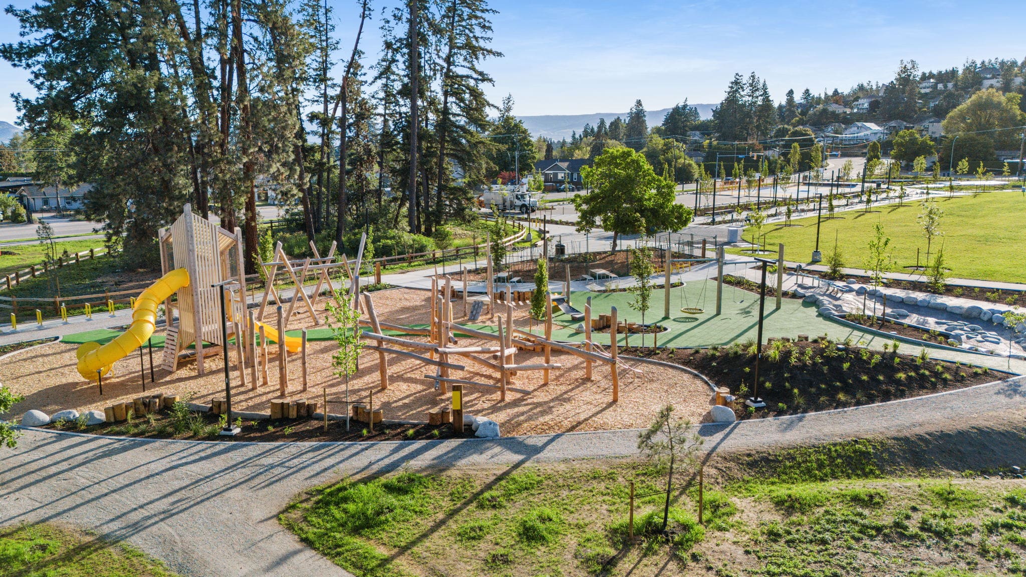 DeHart Community Park playground equipment in Kelowna, BC showing accessible play equipment