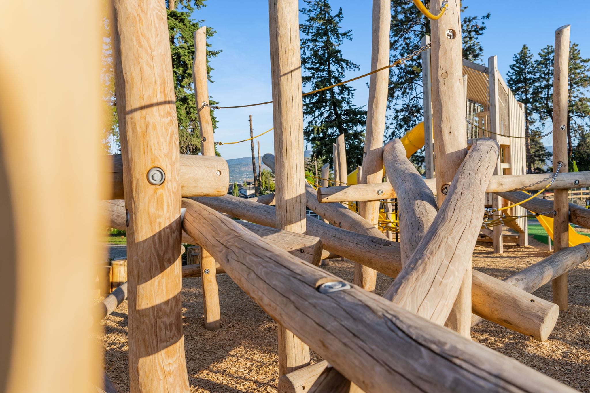 DeHart Community Park playground equipment in Kelowna, BC showing community playground space