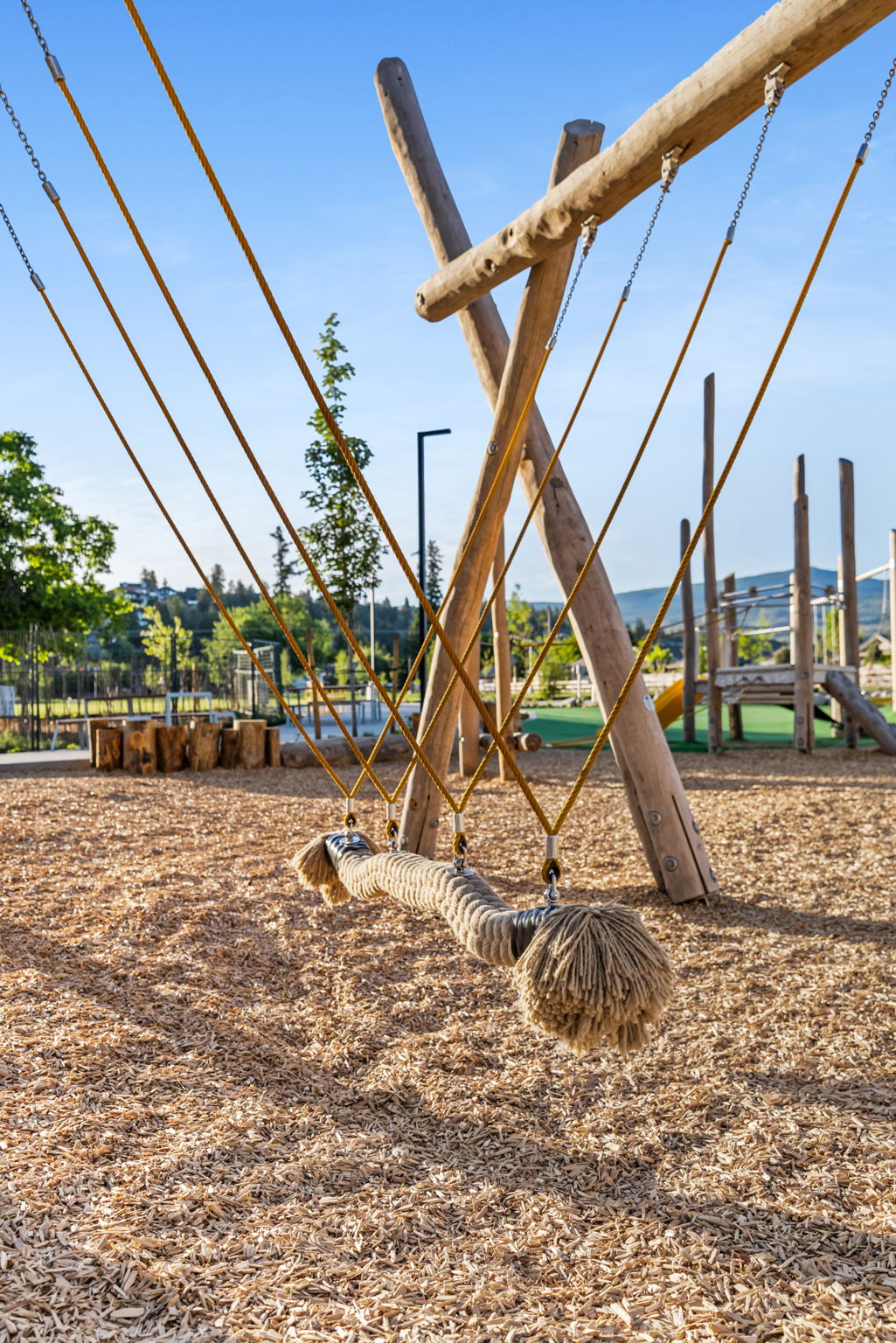 DeHart Community Park playground equipment in Kelowna, BC featuring community playground