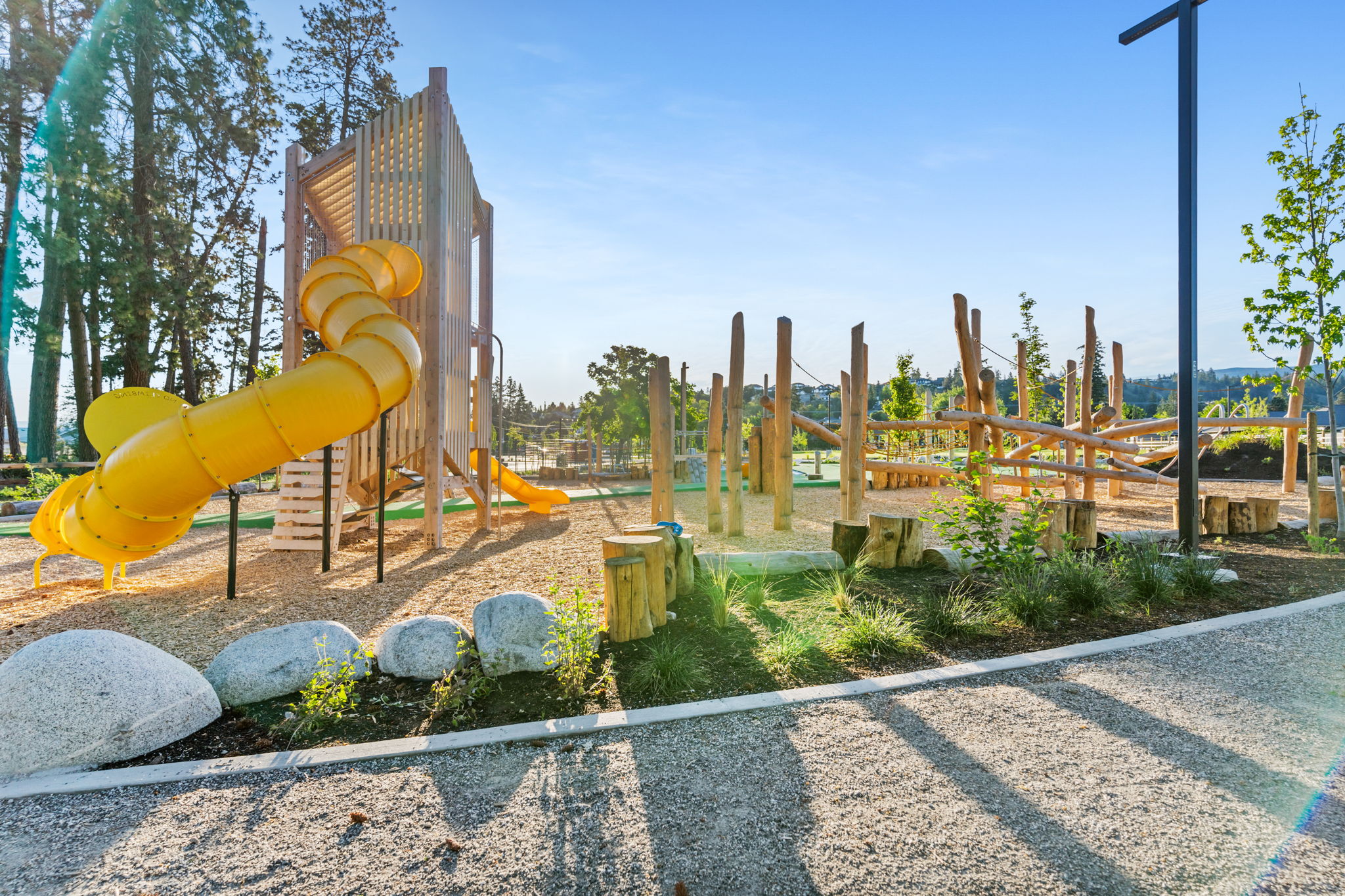 DeHart Community Park playground equipment in Kelowna, BC featuring community playground