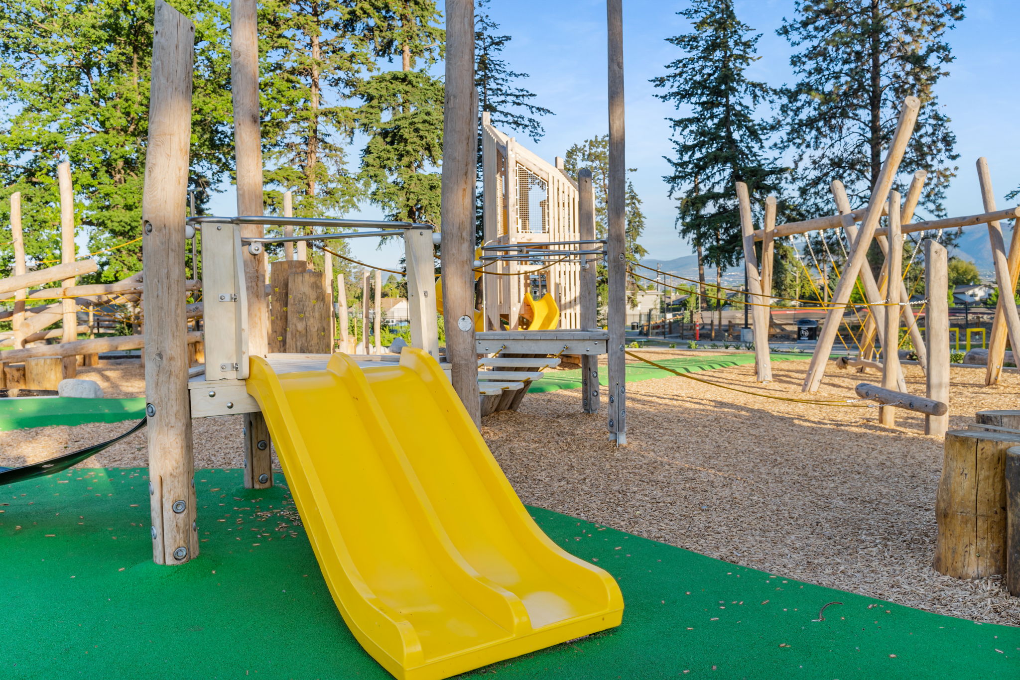 DeHart Community Park playground equipment in Kelowna, BC featuring community playground