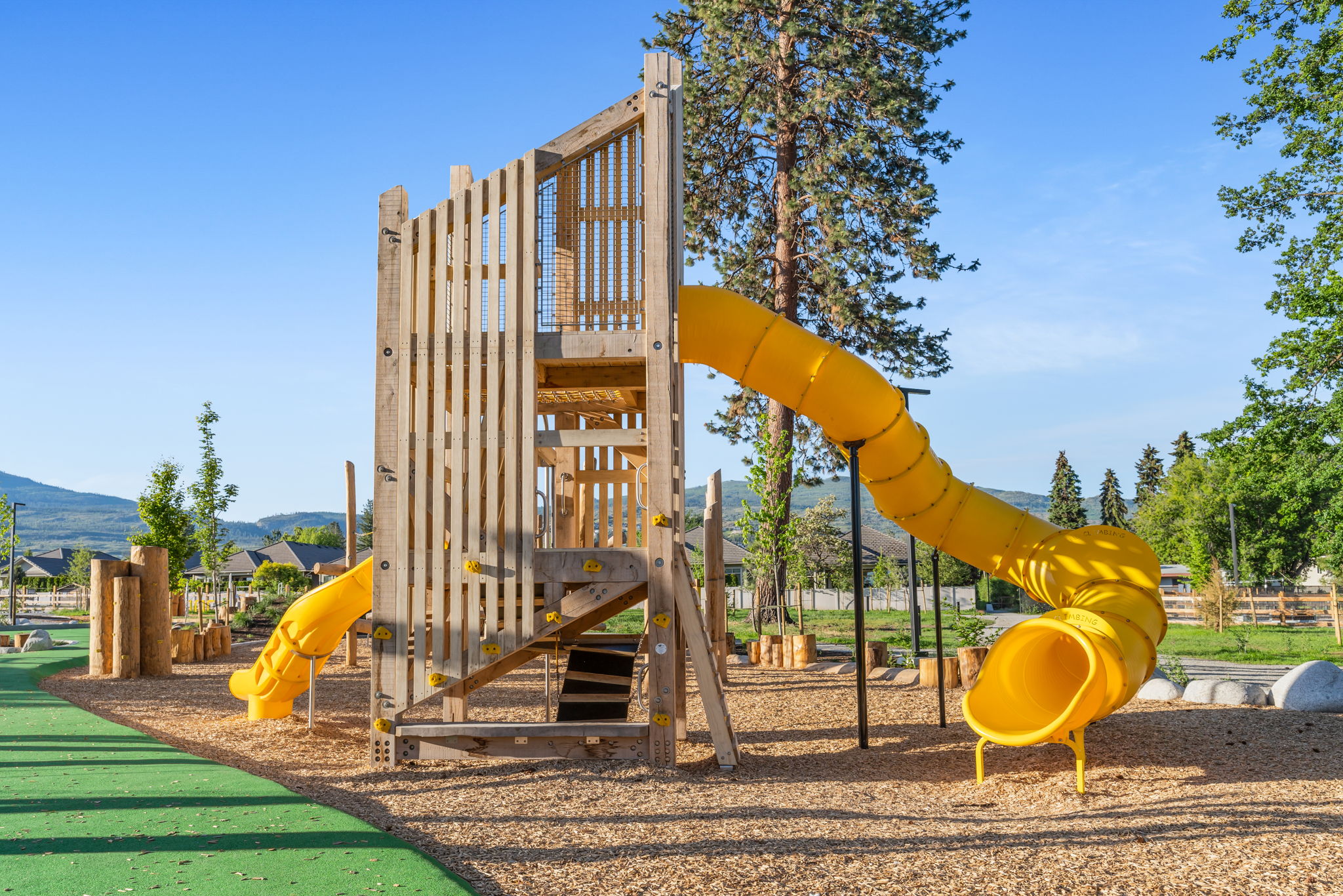 DeHart Community Park playground equipment in Kelowna, BC featuring community playground