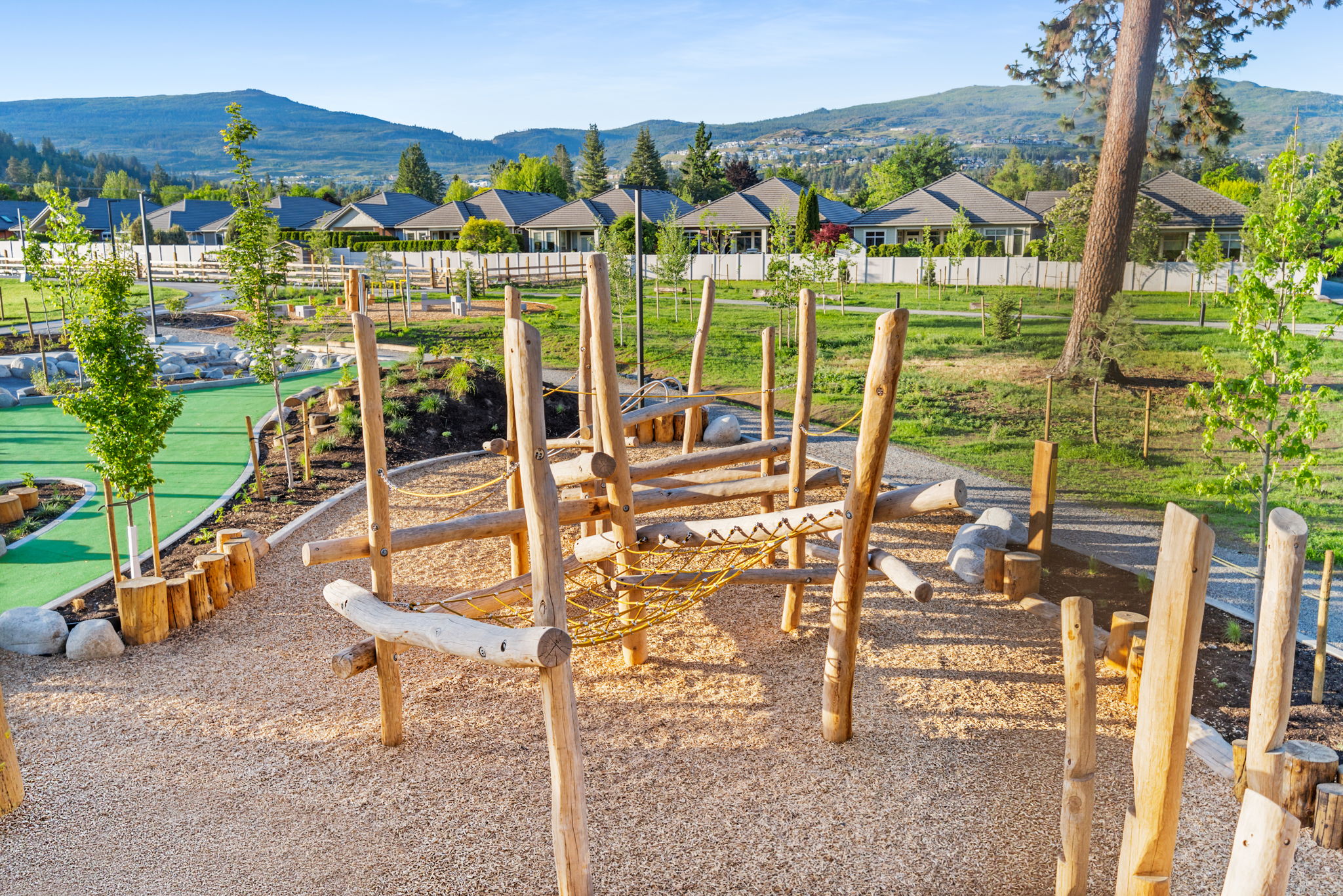 DeHart Community Park playground equipment in Kelowna, BC featuring community playground