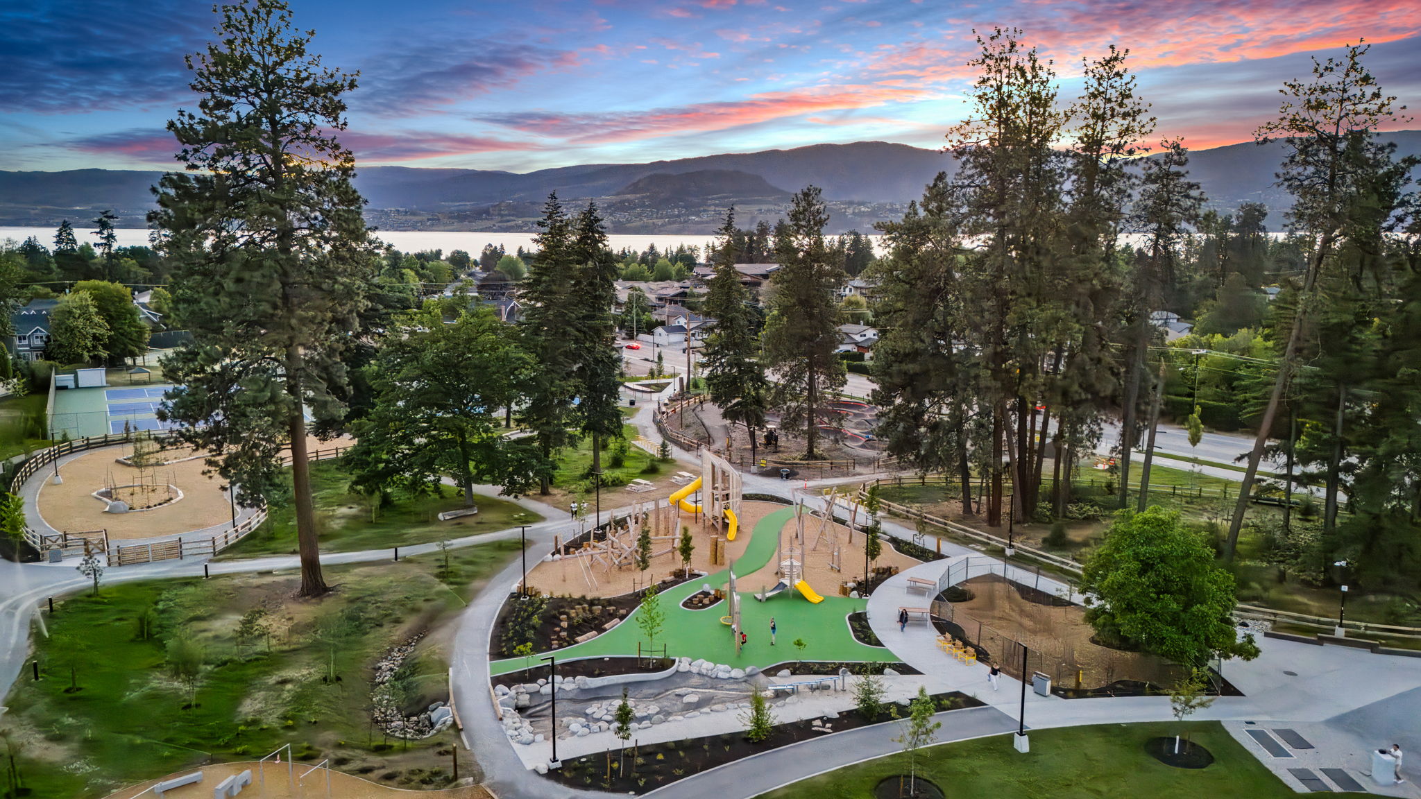 DeHart Community Park playground equipment in Kelowna, BC featuring zipline and adventure equipment