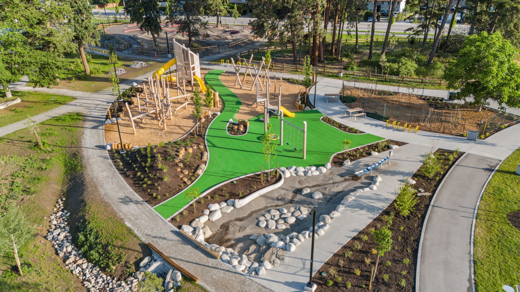 DeHart Community Park playground equipment in Kelowna, BC featuring modern playground design