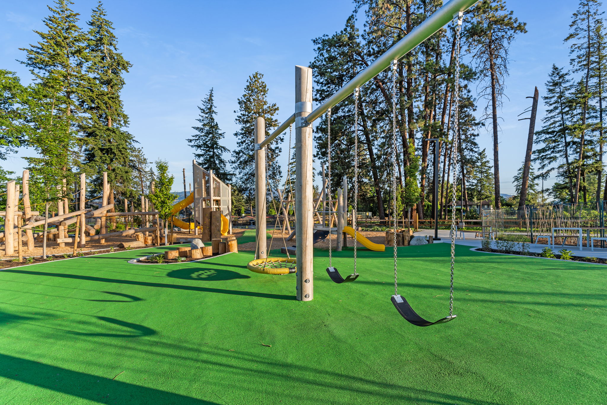 DeHart Community Park playground equipment in Kelowna, BC featuring community playground