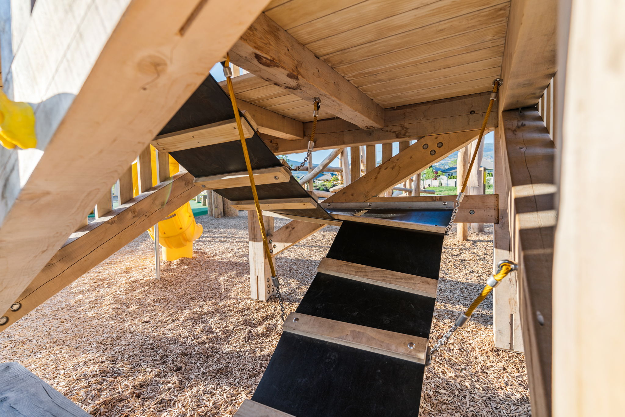 DeHart Community Park playground equipment in Kelowna, BC featuring community playground
