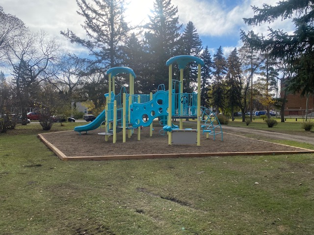 Coronation Park playground equipment in Brandon, MB featuring colorful play structures