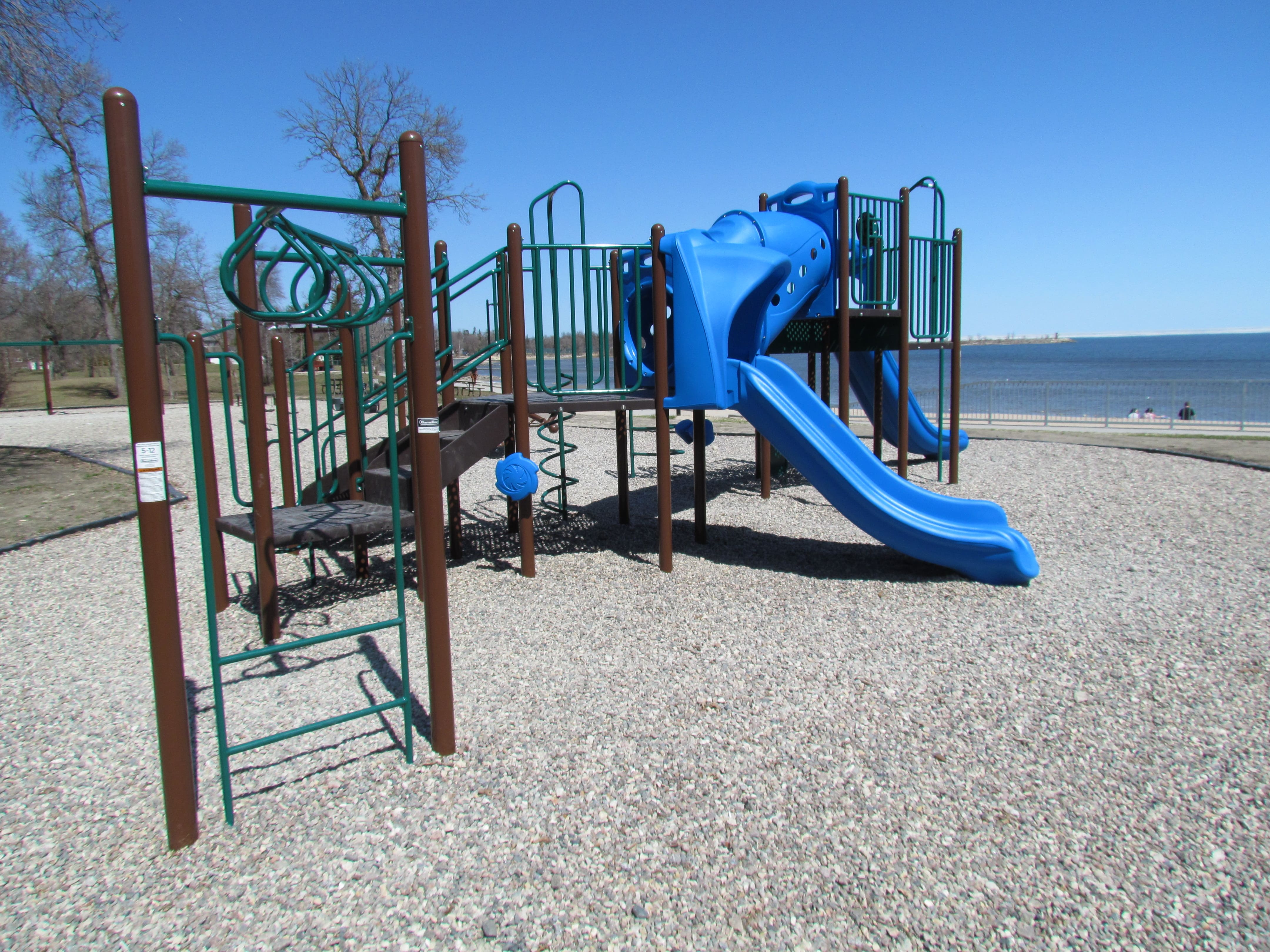 Winnipeg Beach Provincial Park playground equipment in Winnipeg Beach, MB with safety surfacing and equipment