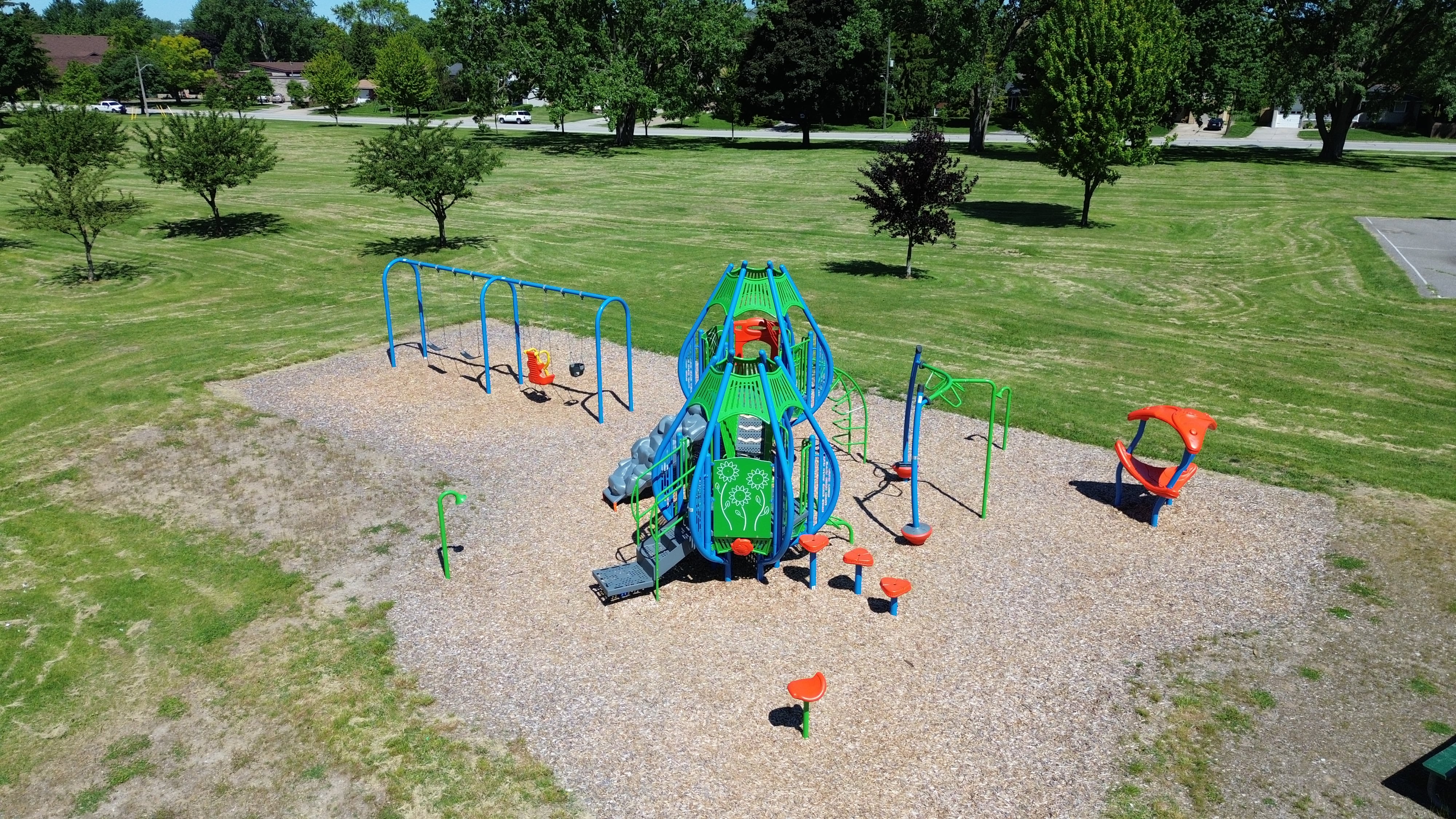 Newton Park playground equipment in Sarnia, ON with safety surfacing and equipment