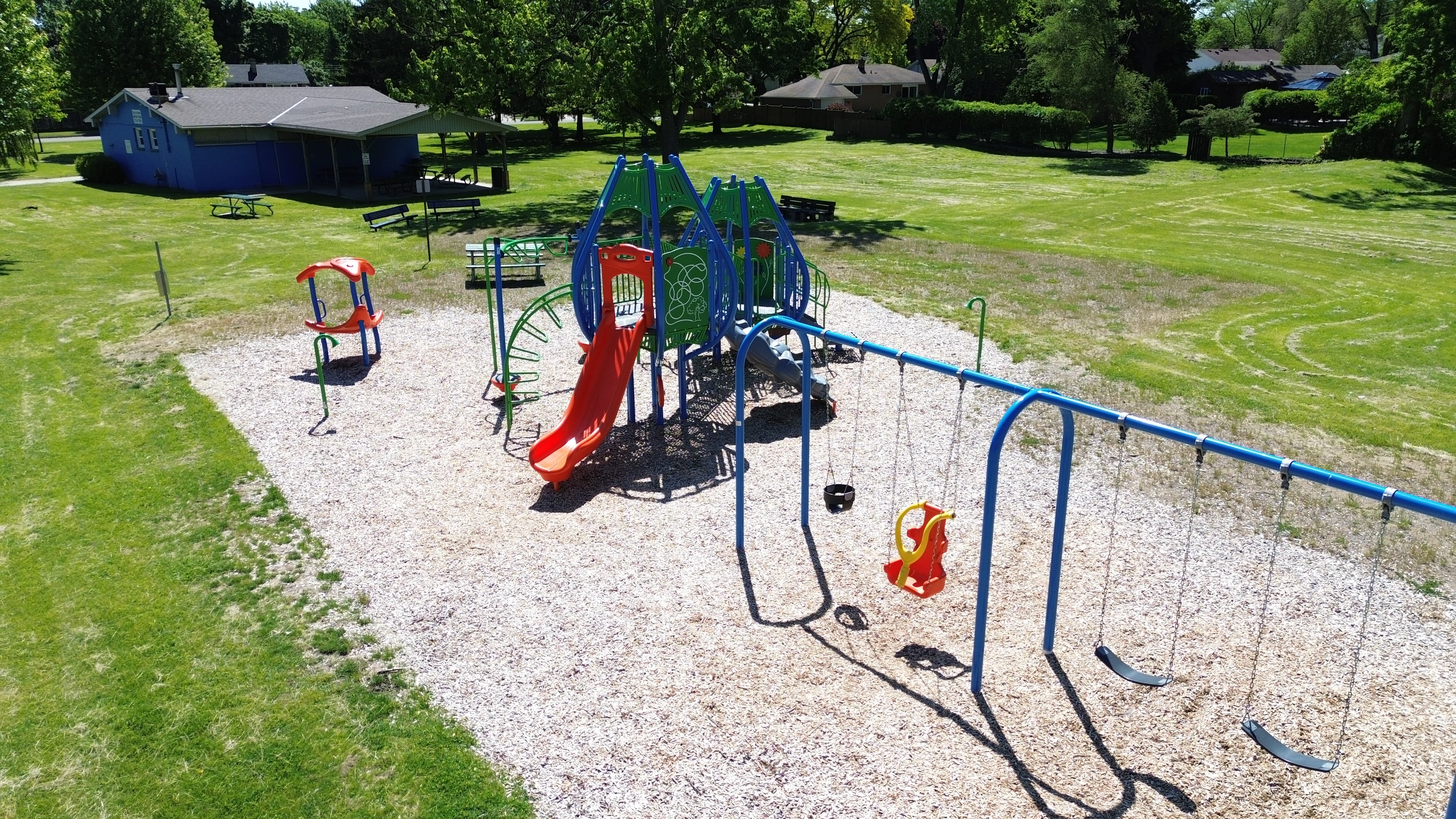Newton Park playground equipment in Sarnia, ON with inclusive play features