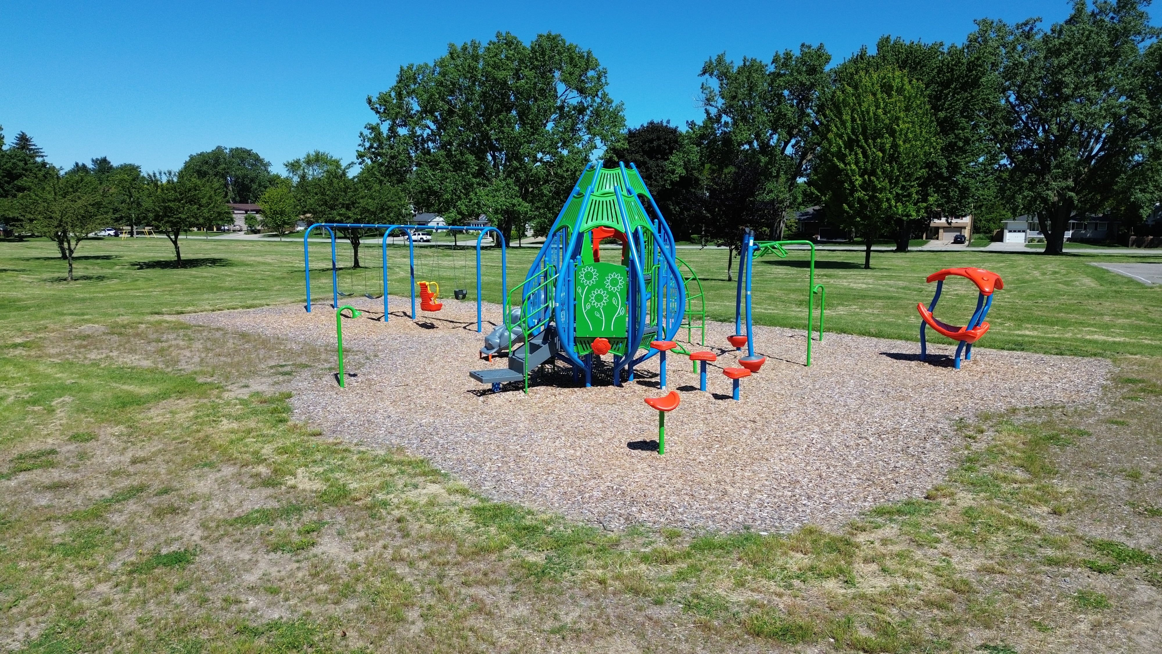Newton Park playground equipment in Sarnia, ON with climbing and sliding features
