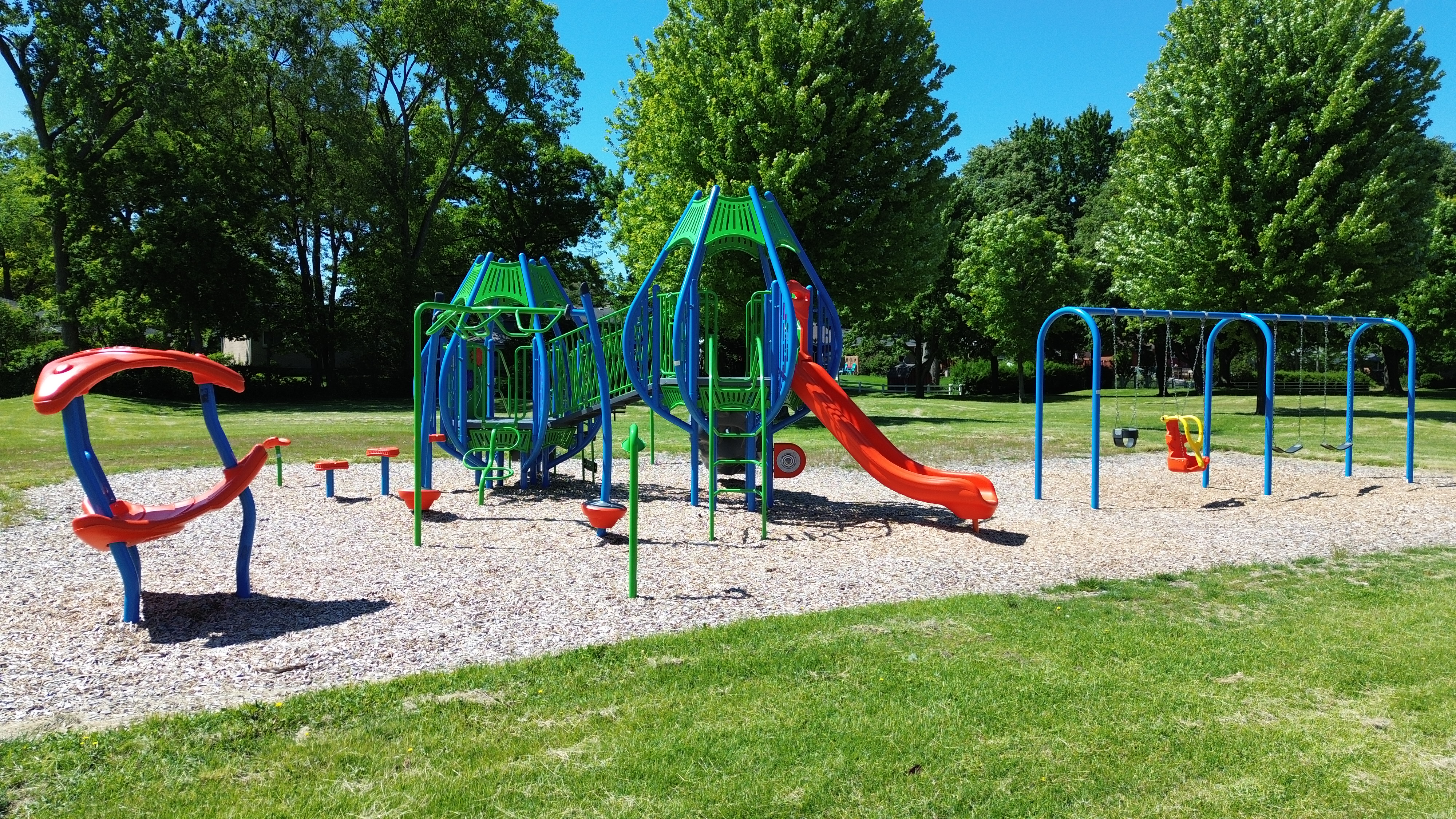 Newton Park playground equipment in Sarnia, ON showing community playground space