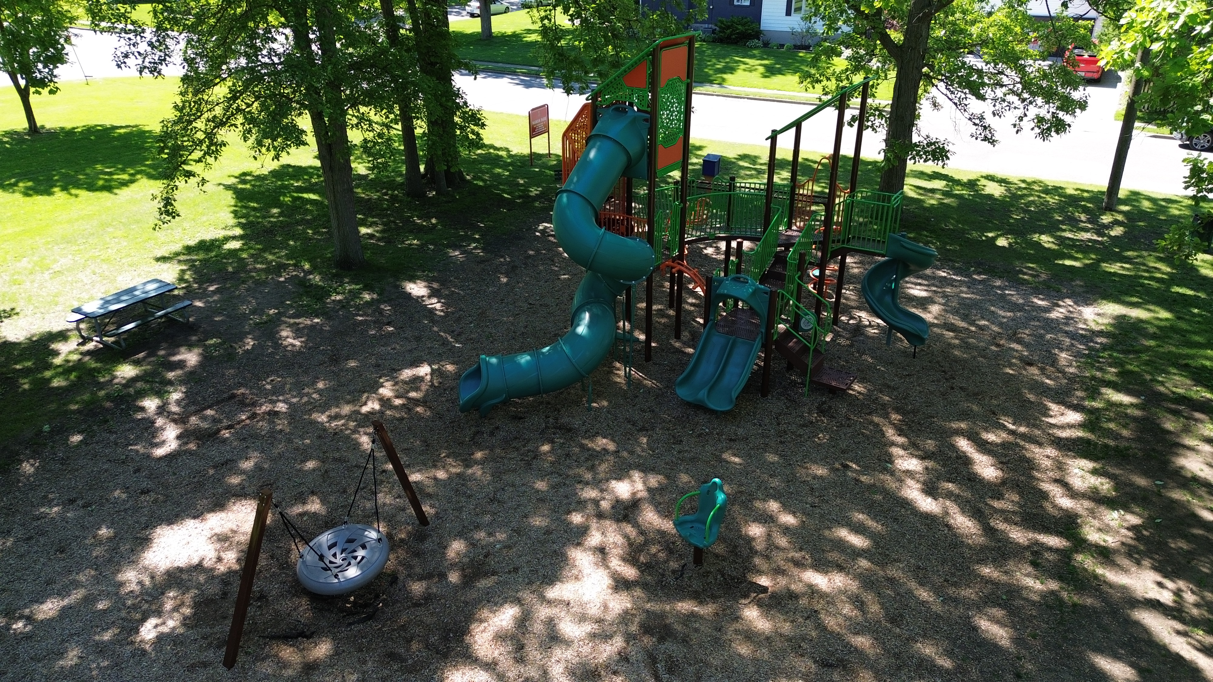 Marcin Park playground equipment in Sarnia, ON showing swing sets and climbing areas