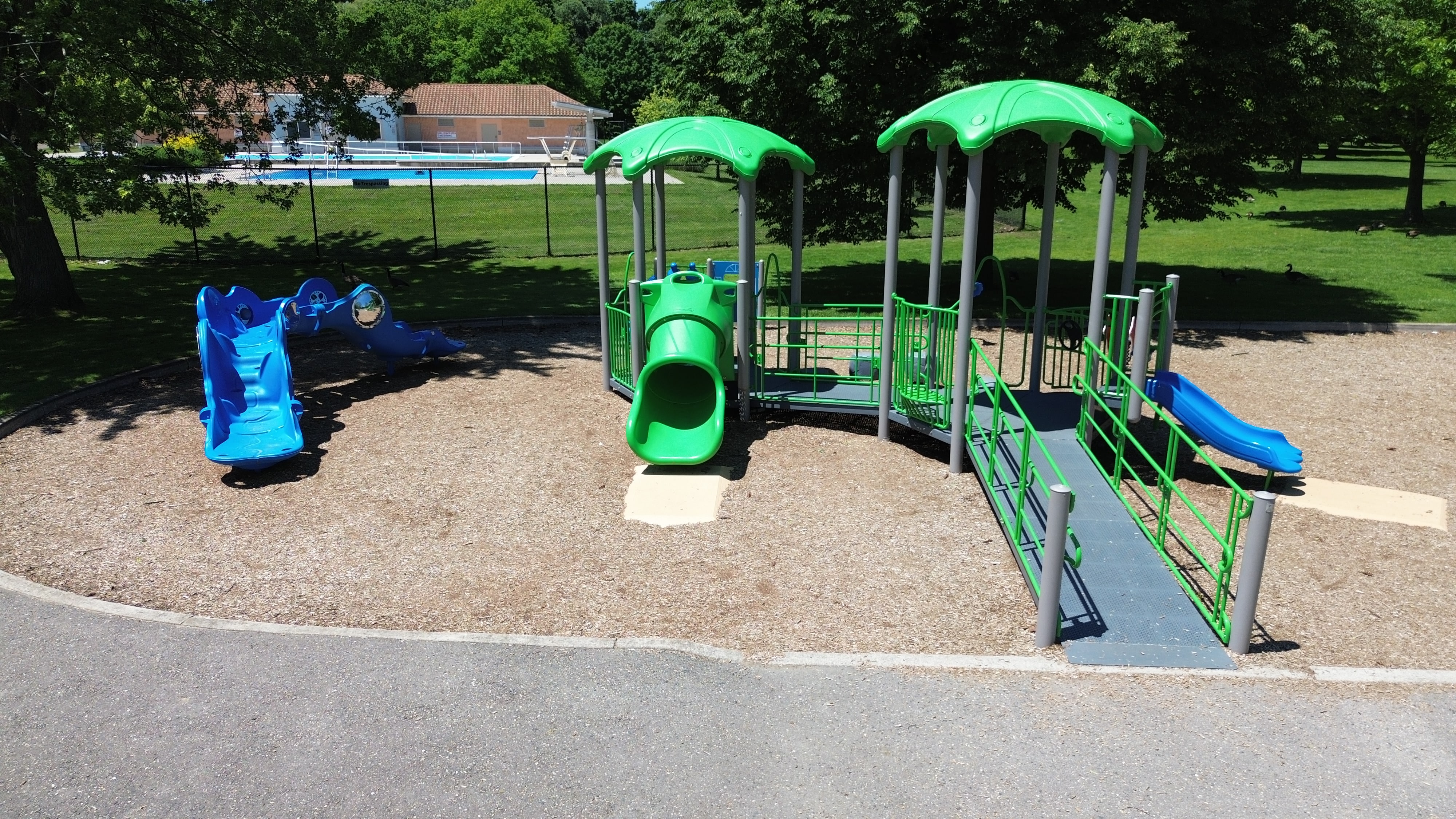 Gibbons Park playground equipment in London, ON featuring colorful play structures