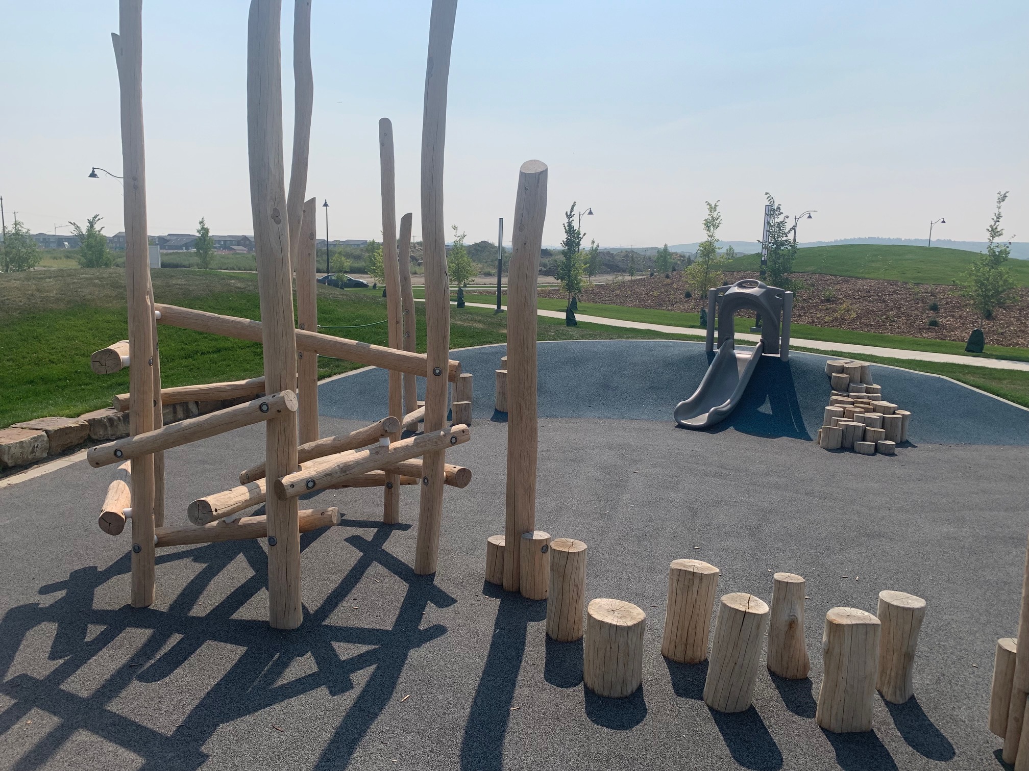 Yorkville Central Park playground equipment in Calgary, AB with inclusive play features