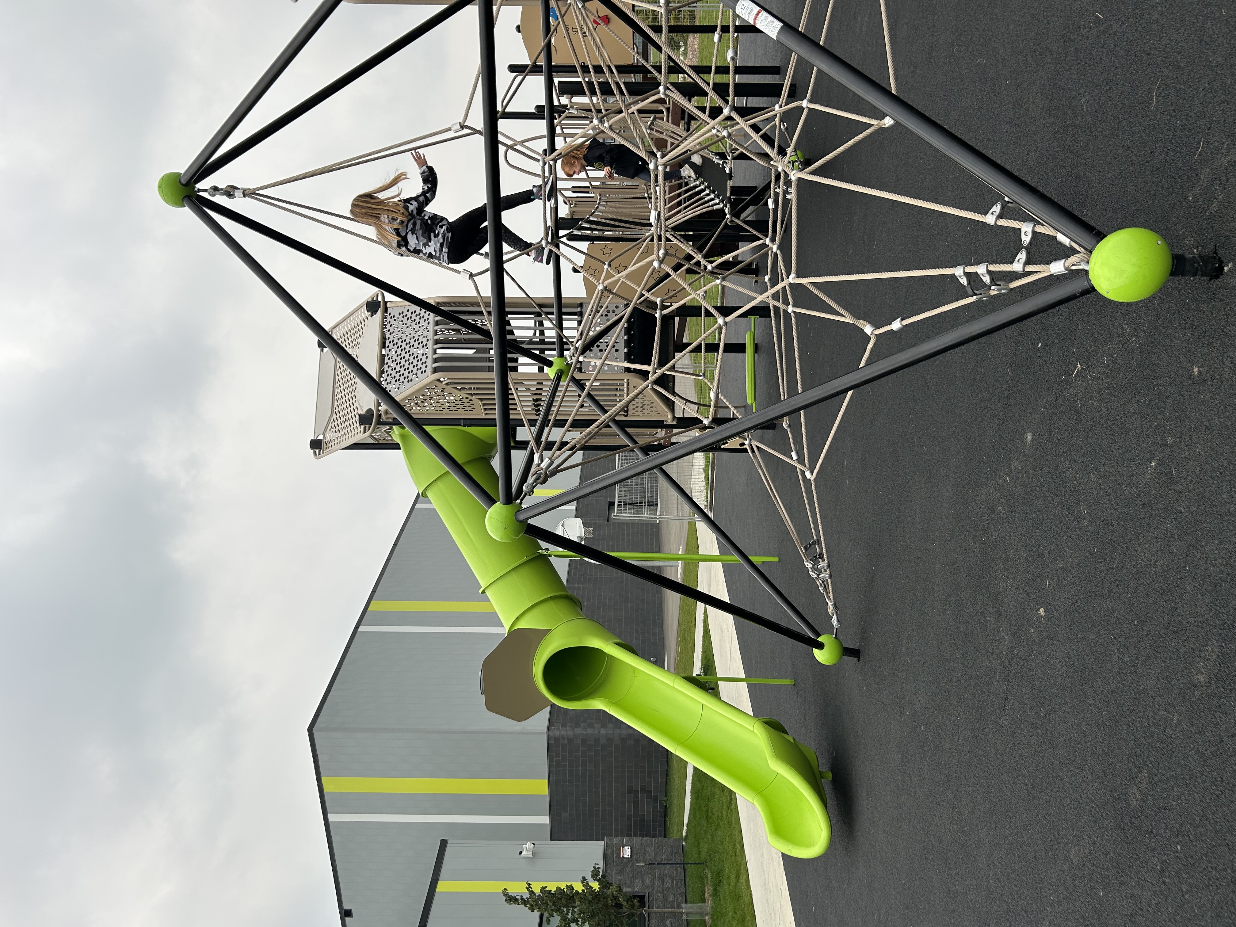 Joan Carr School playground equipment in Edmonton, AB featuring colorful play structures