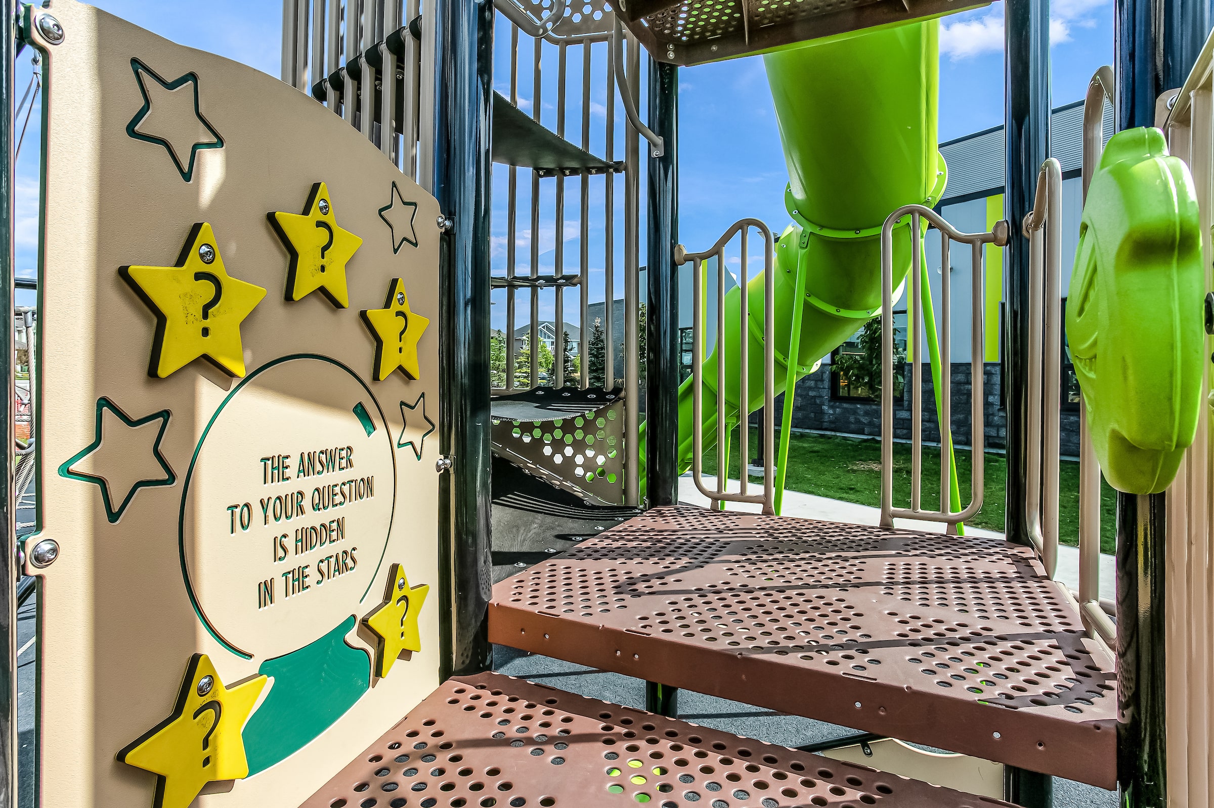 Joan Carr School playground equipment in Edmonton, AB showing natural play materials