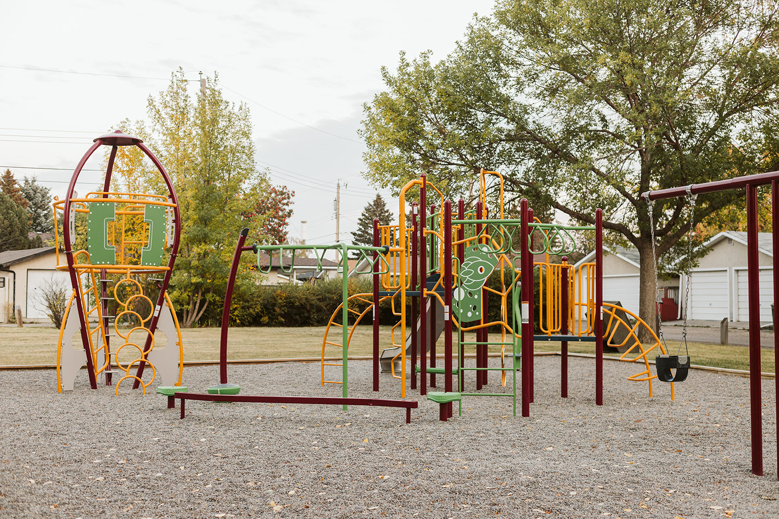 Marchand Park playground in Calgary, AB with neighborhood playground