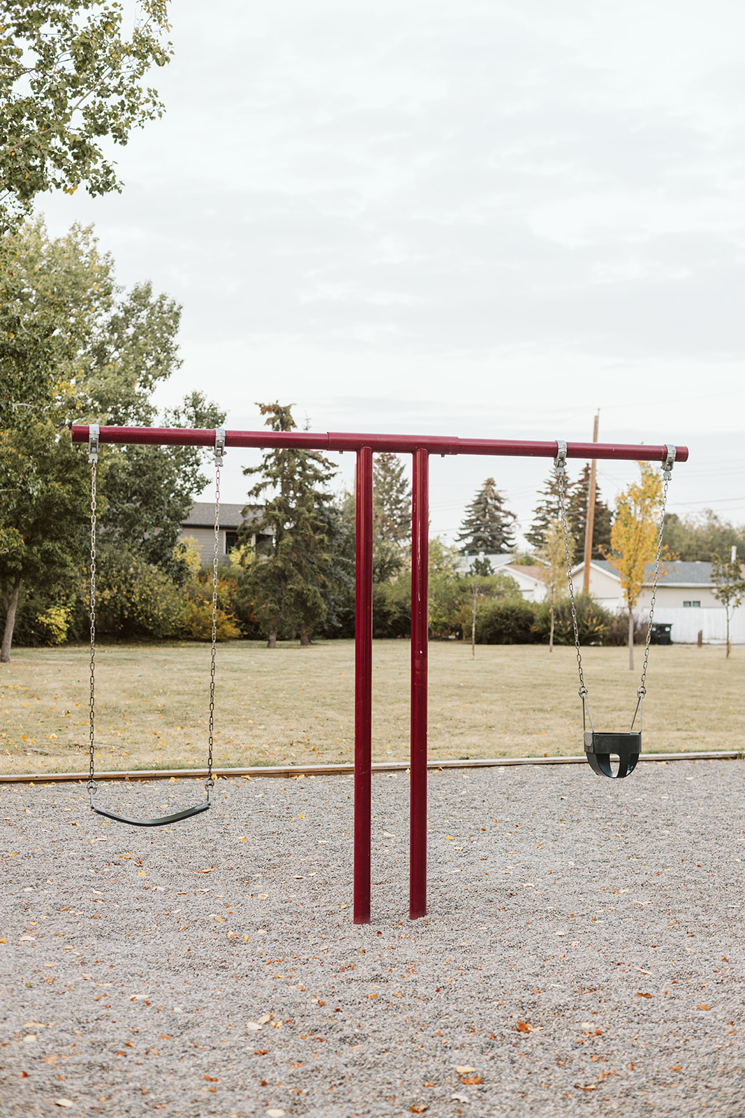 Marchand Park playground equipment in Calgary, AB with climbing and sliding features