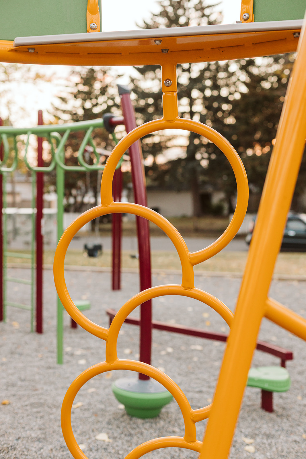 Marchand Park playground equipment in Calgary, AB showing natural play materials