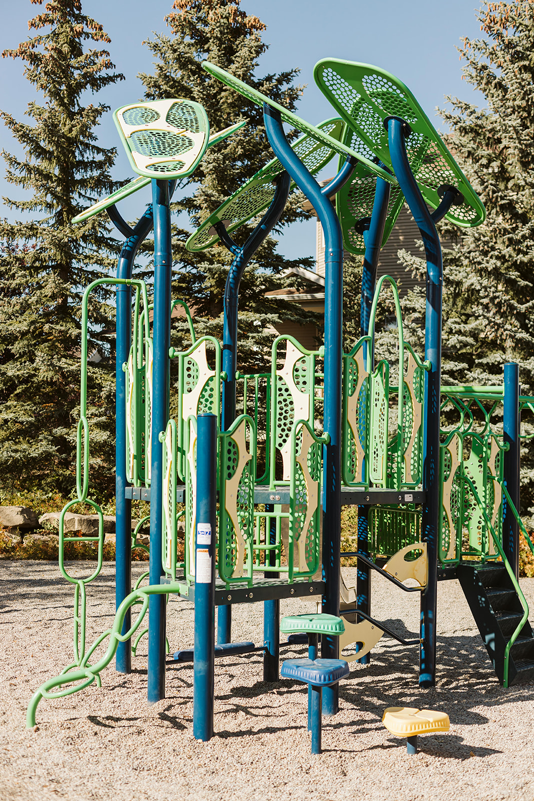 Avalon Playground playground equipment in Calgary, AB with climbing and sliding features