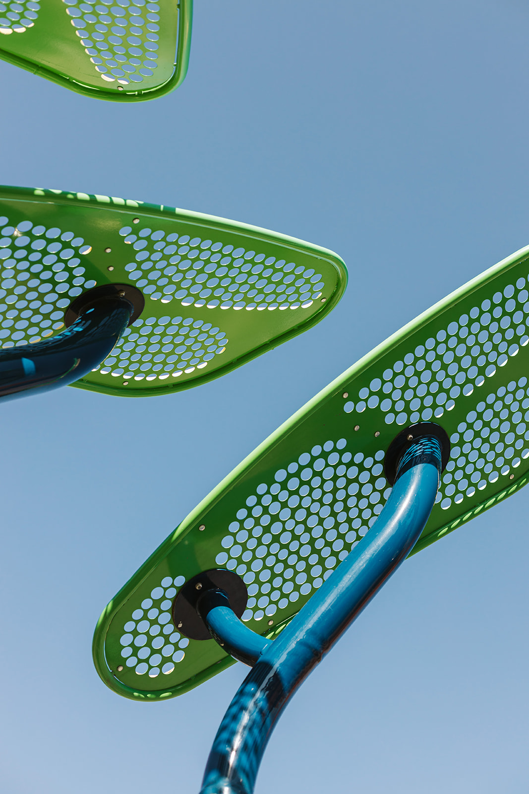 Avalon Playground playground equipment in Calgary, AB featuring slides and activity panels