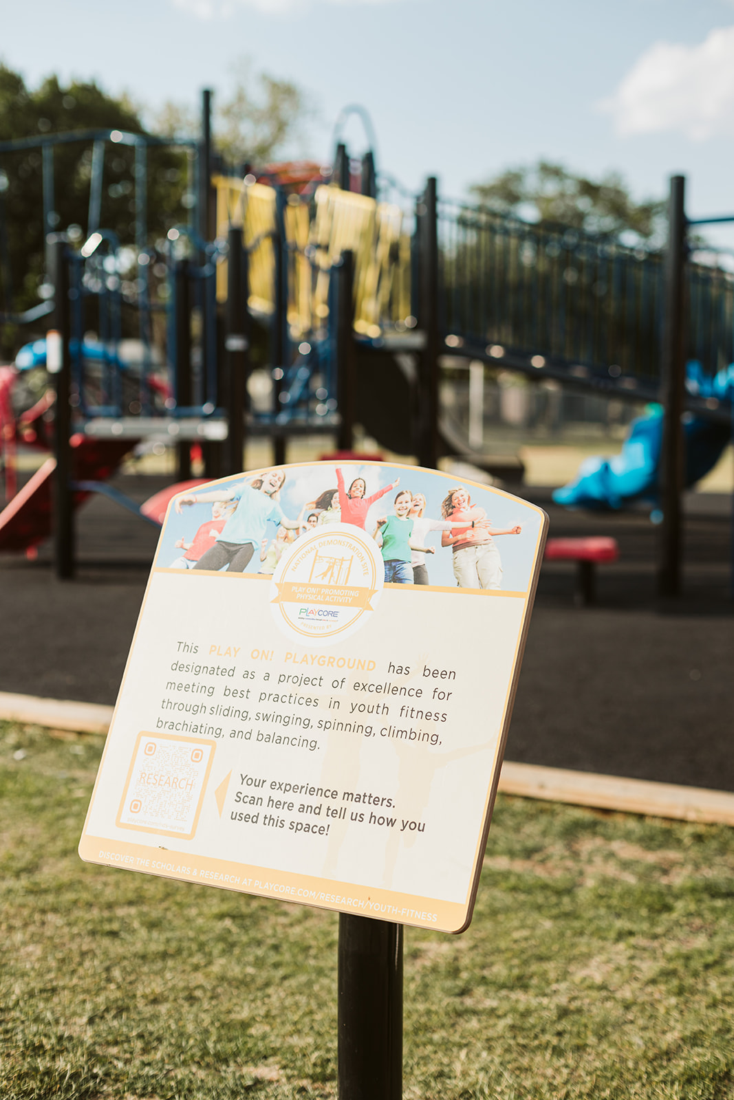St. Thomas Aquinas School Playground playground equipment in Calgary, AB featuring colorful play structures
