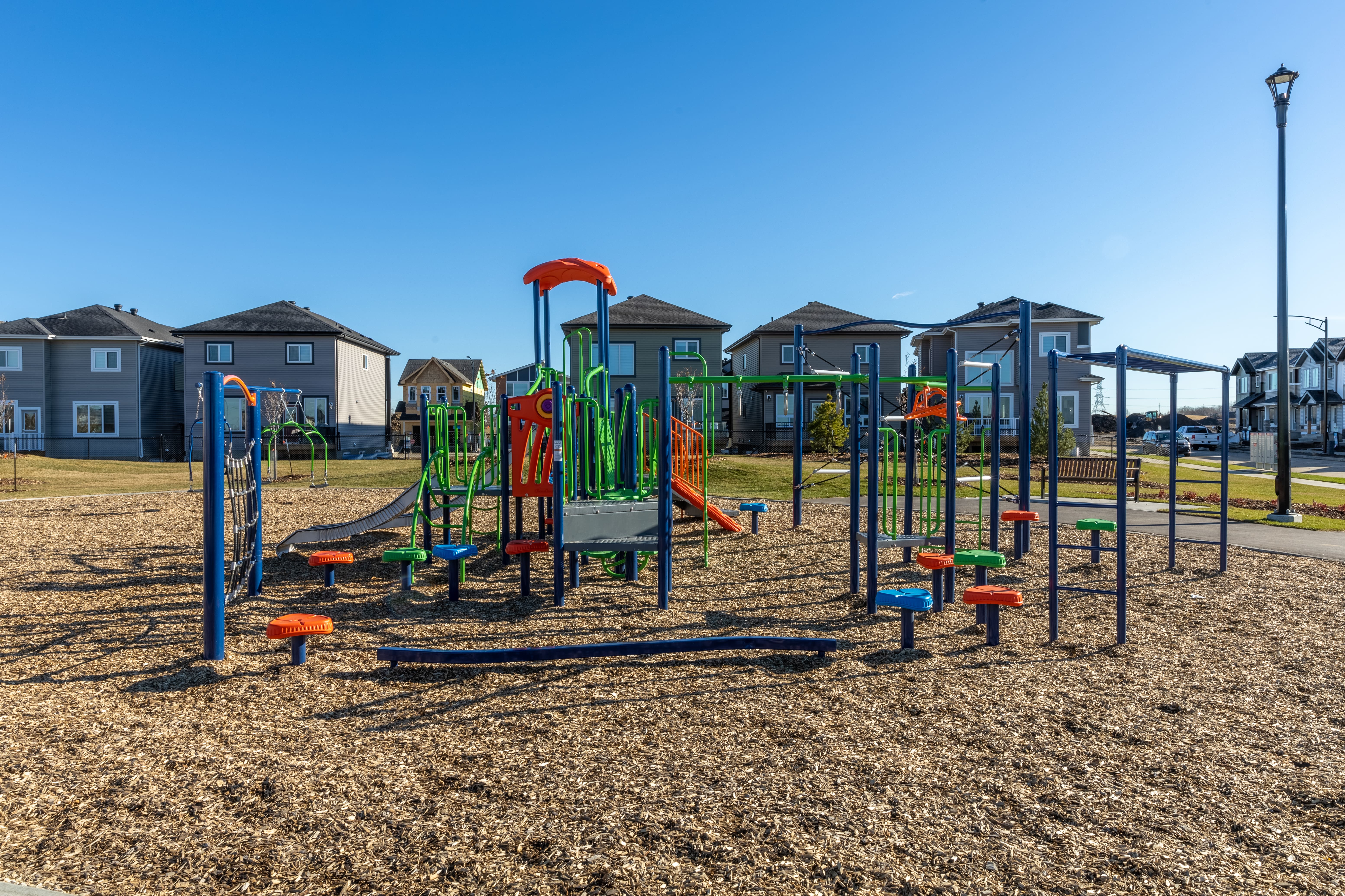 Aster Community Playground playground equipment in Edmonton, AB showing accessible play equipment