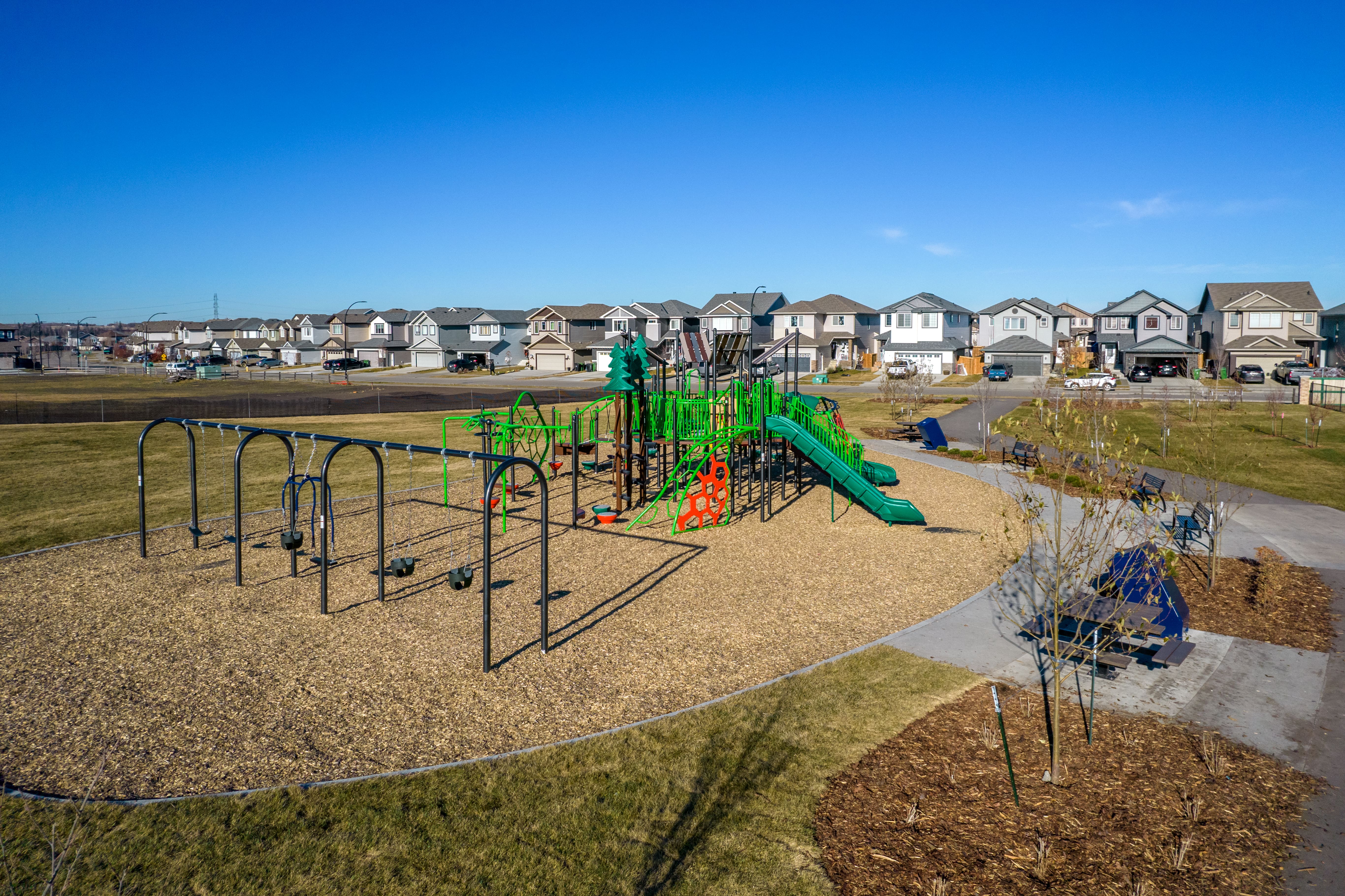 Forest Ridge playground equipment in Fort Saskatchewan, SK with accessible pathways