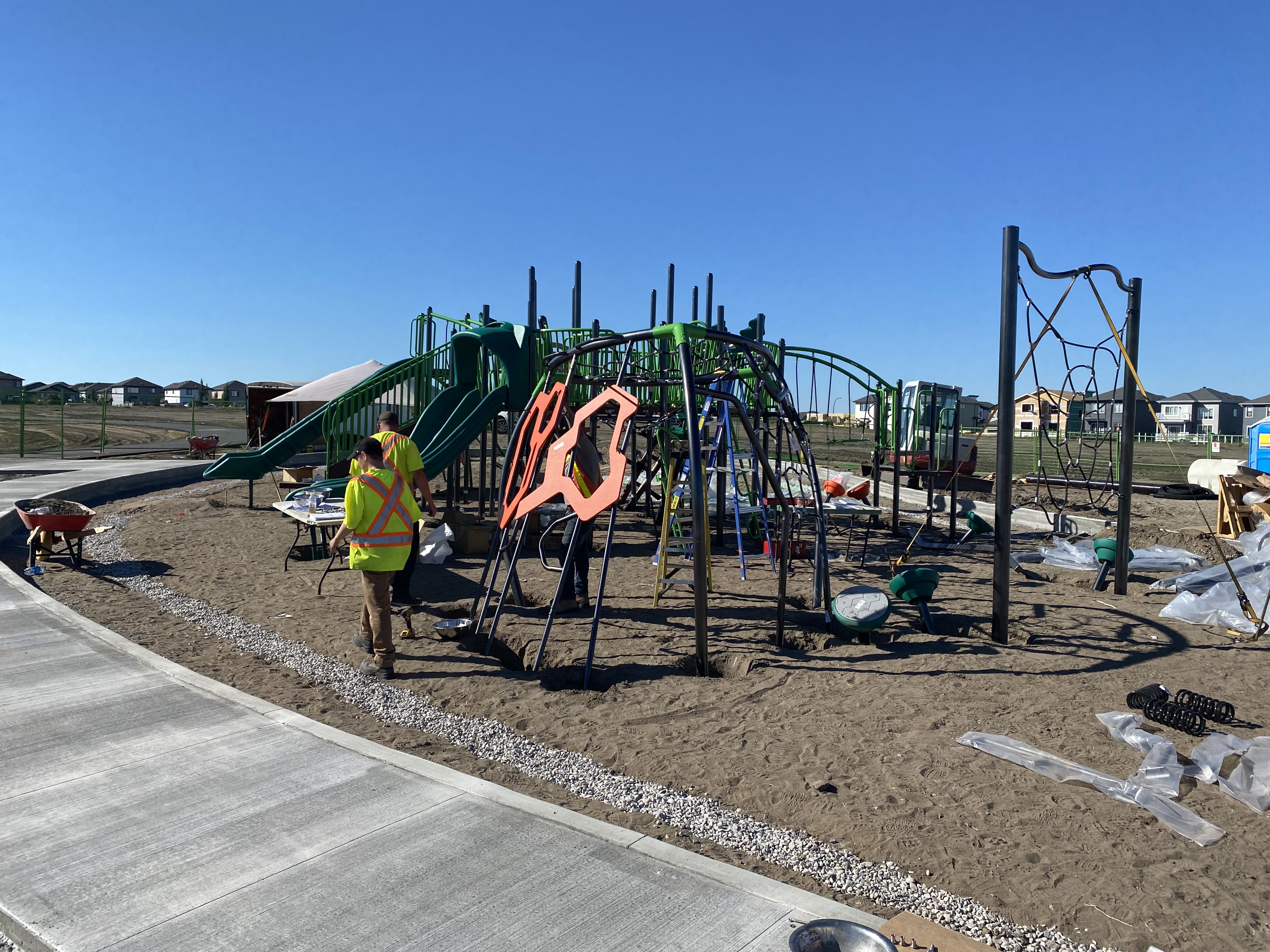 Forest Ridge playground equipment in Fort Saskatchewan, SK with climbing and sliding features