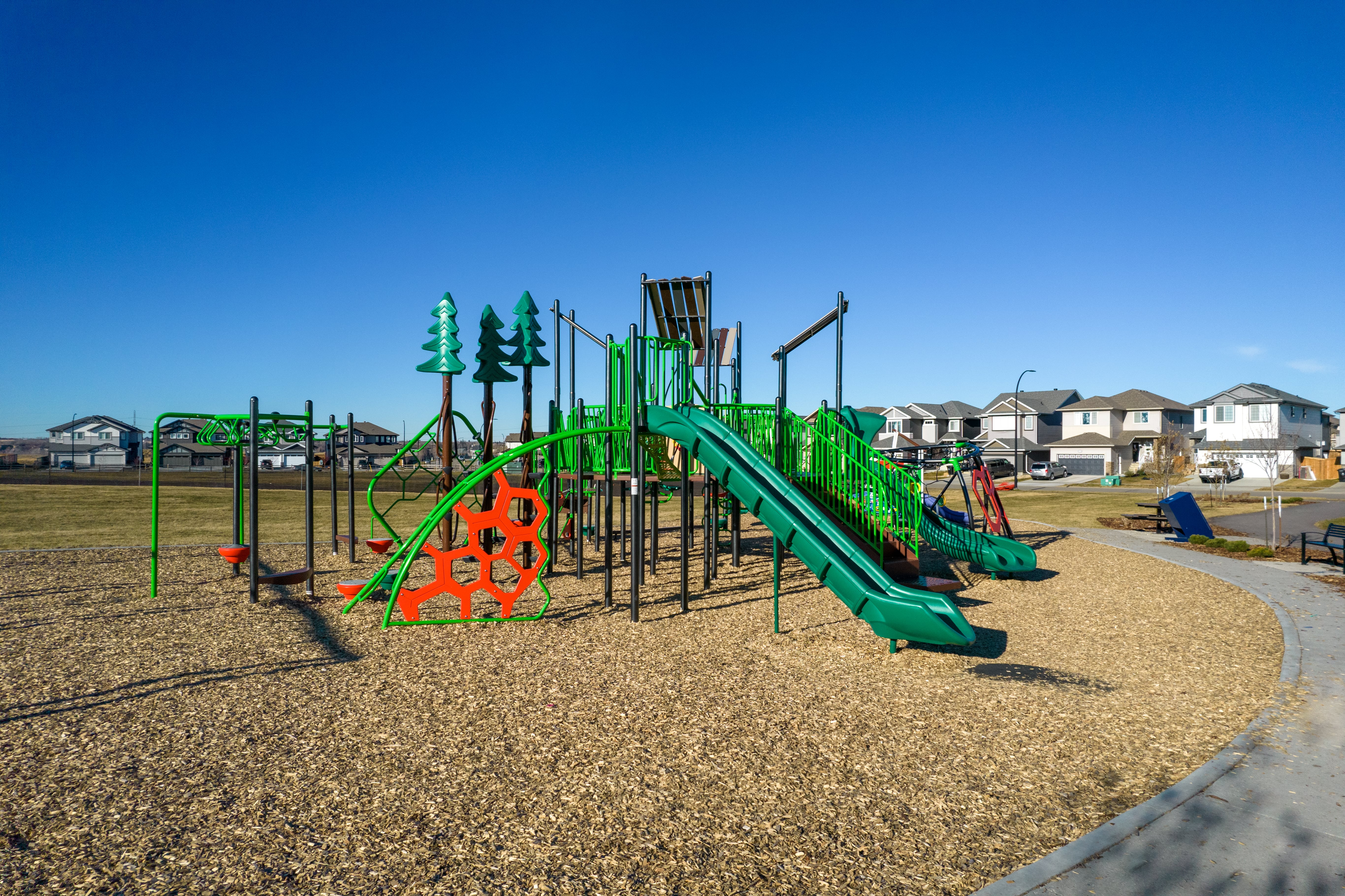 Forest Ridge playground equipment in Fort Saskatchewan, SK featuring beachfront access