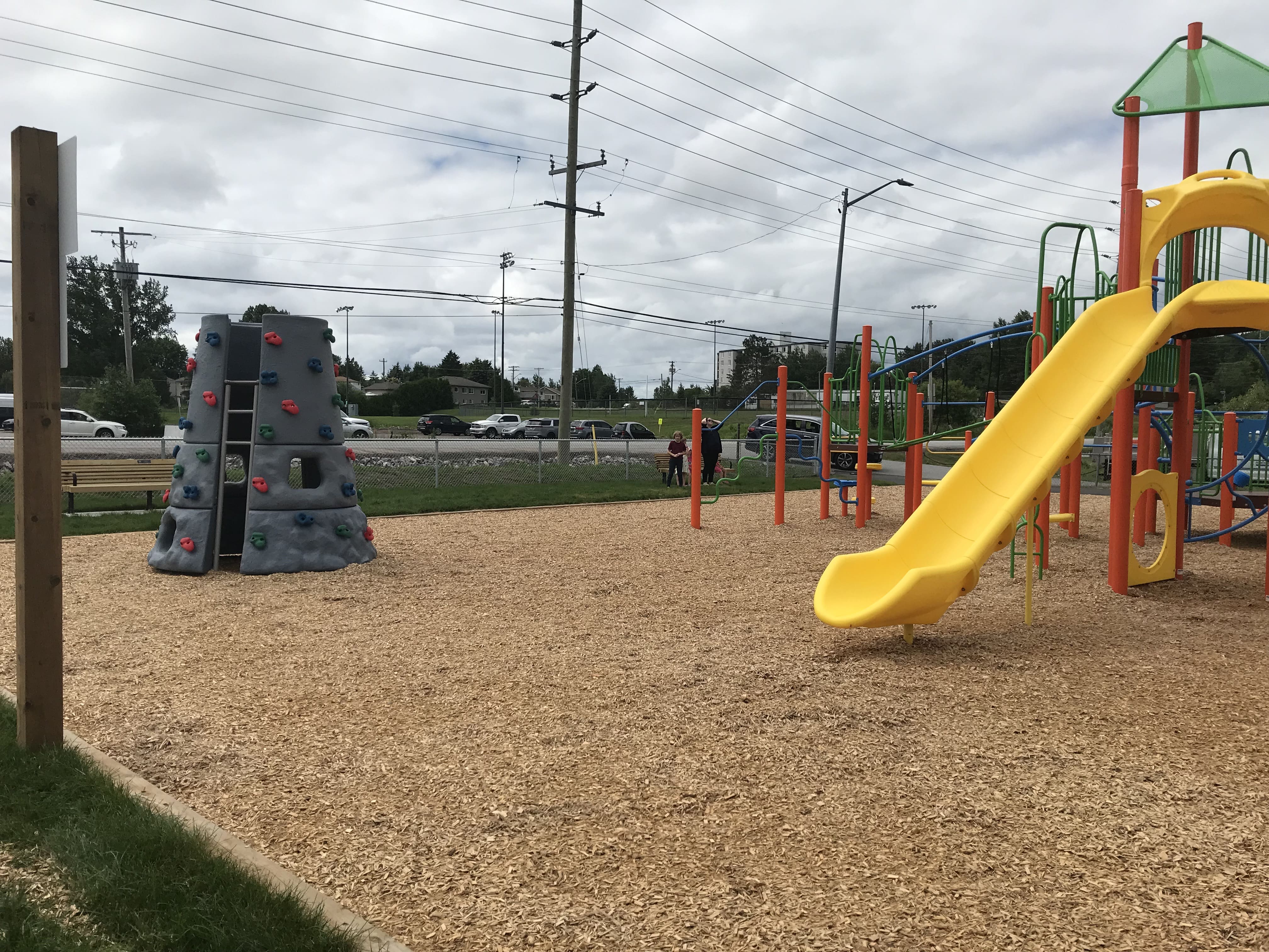 Olmstead Beach playground equipment in North Bay, ON with inclusive play features